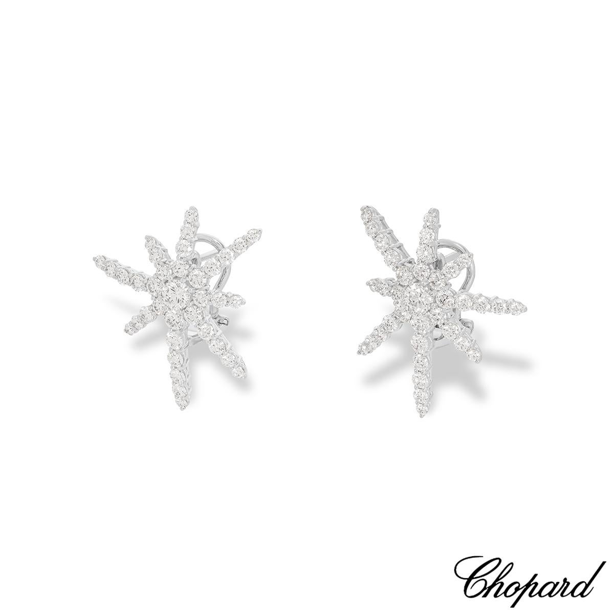 A spectacular pair of 18k white gold diamond earrings by Chopard. The earrings feature a starburst design set with 72 round brilliant cut diamonds weighing 3.22ct, E-F colour and VVS-VS clarity. They measure 28mm in length and 24mm in width, finish