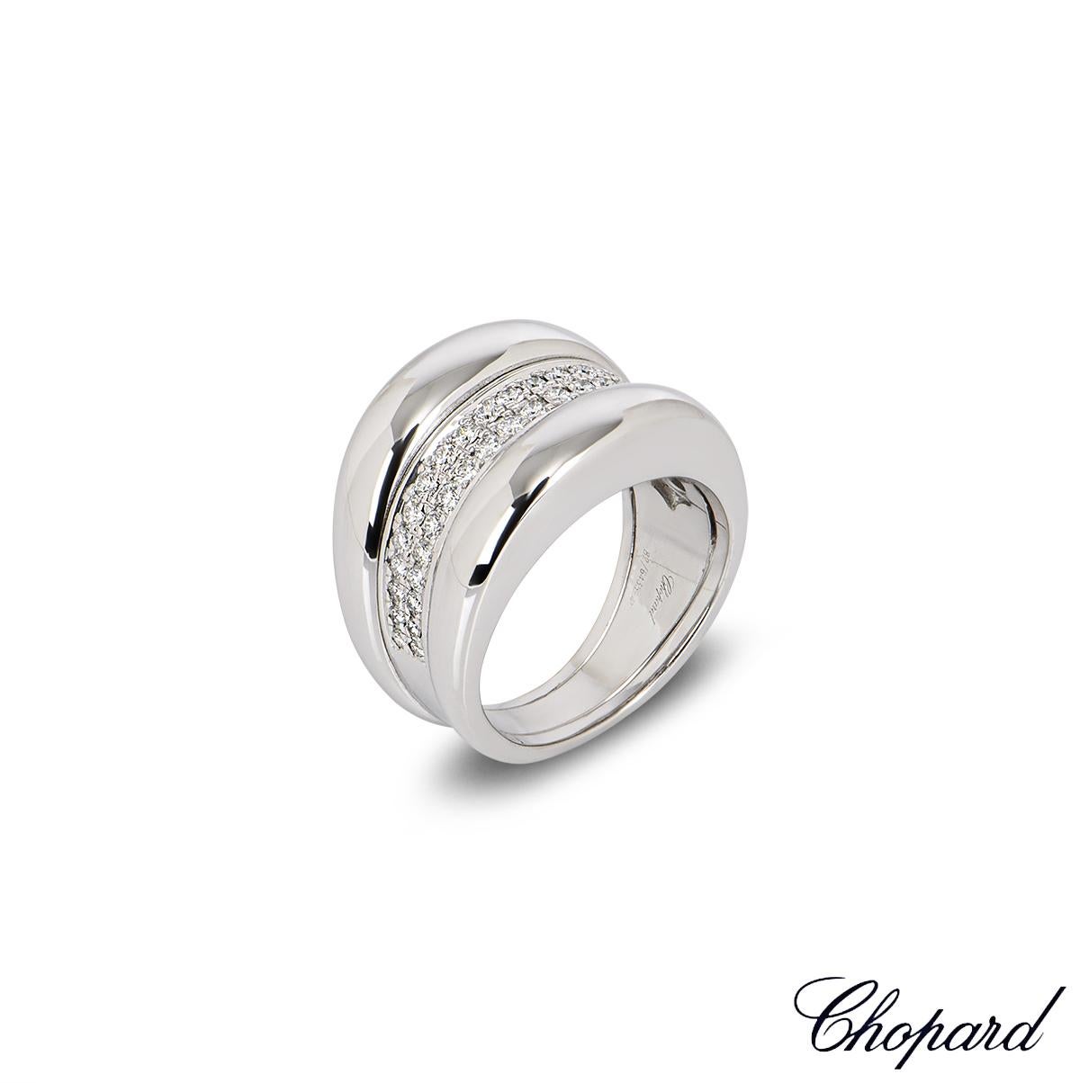 A dazzling Chopard 18k white gold diamond ring from the La Strada collection. The ring is set to the centre with two rows of 42 pave set round brilliant cut diamonds totalling 0.62ct surrounded by a raised domed border on either side. The ring is