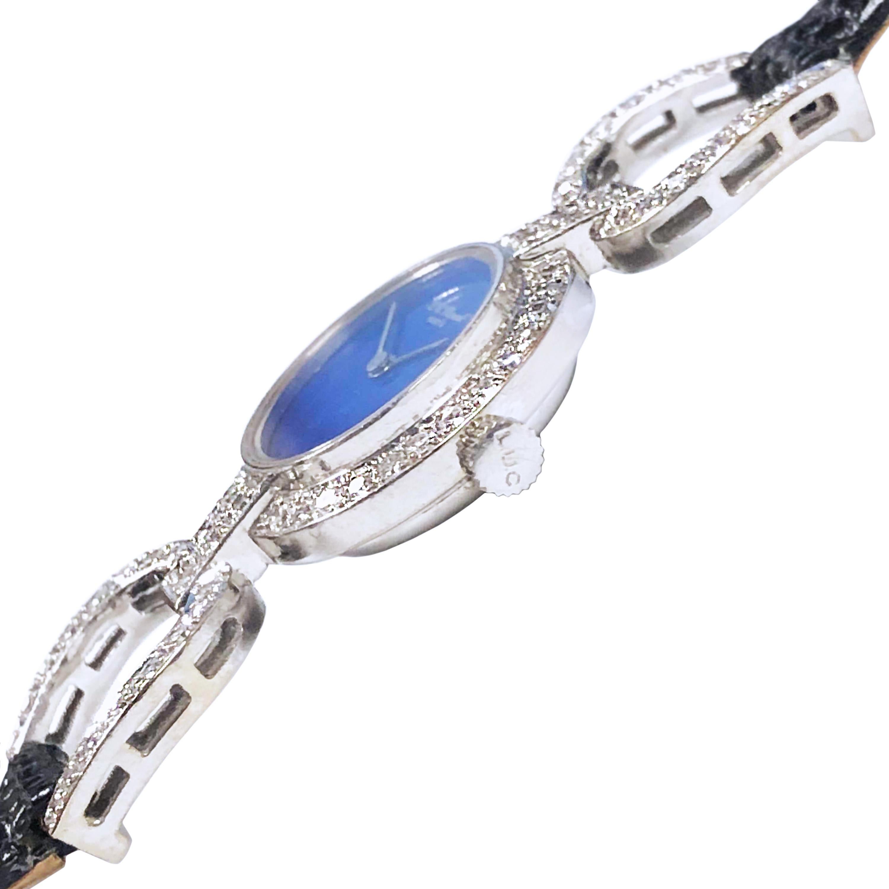 Circa 1970s Chopard Ladies Wrist Watch, 18K White Gold 20 MM 2 Piece Case with a Diamond set Bezel and Flexible Horseshoe ends. Diamonds total wight 1.50 Carats. 17 Jewel, Mechanical, Manual wind Movement. Lapis Lazuli Dial. New Black Lizard Strap