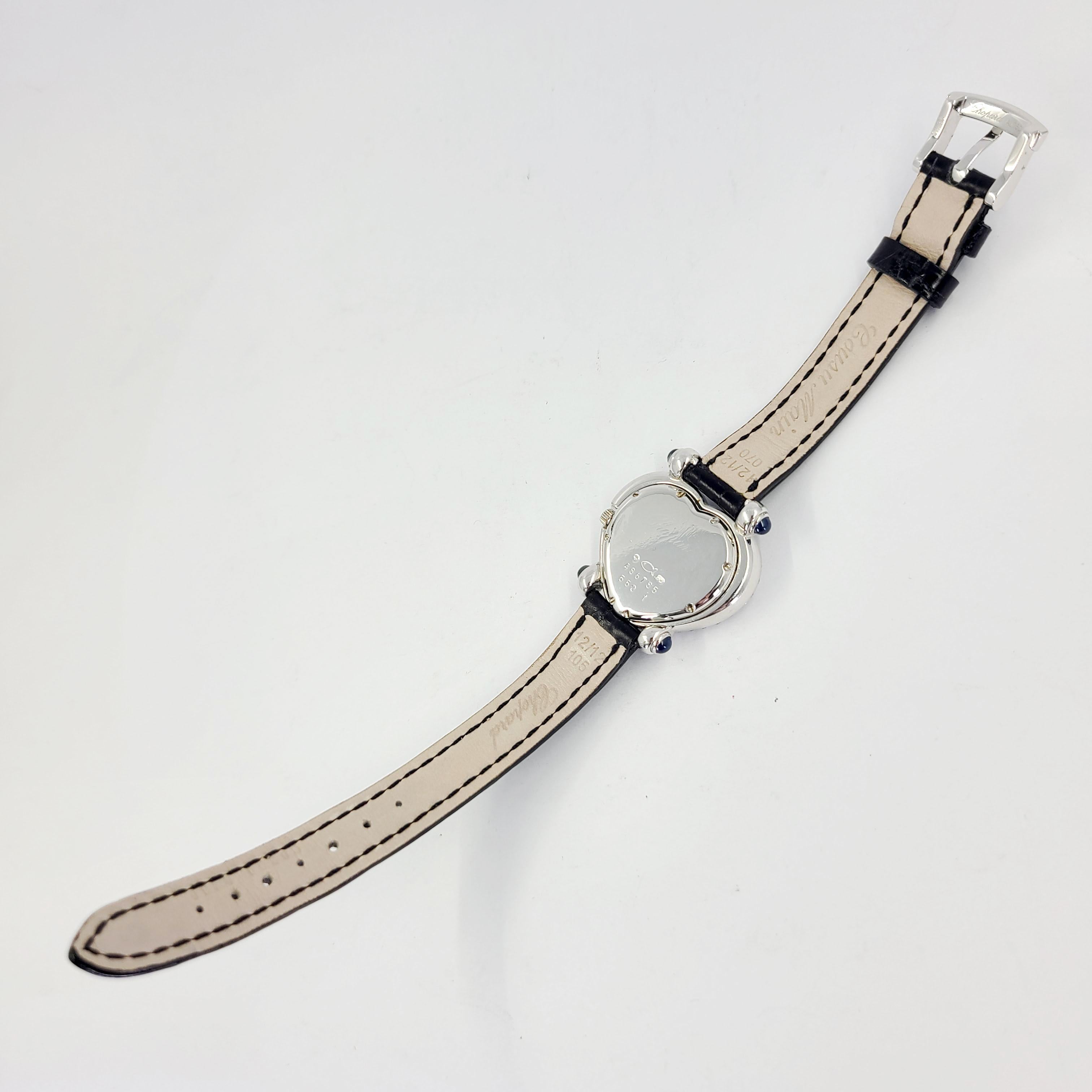 Pre-Owned 18 Karat White Gold Chopard Quartz Watch, Model 550-1 Featuring Pave Diamond Heart Shaped Case & Dial On Original Black Gator Strap With Diamond Set 18 Karat White Gold Tang Buckle. $25,000 MSRP Battery Replaced Upon Purchase, With 1 Year