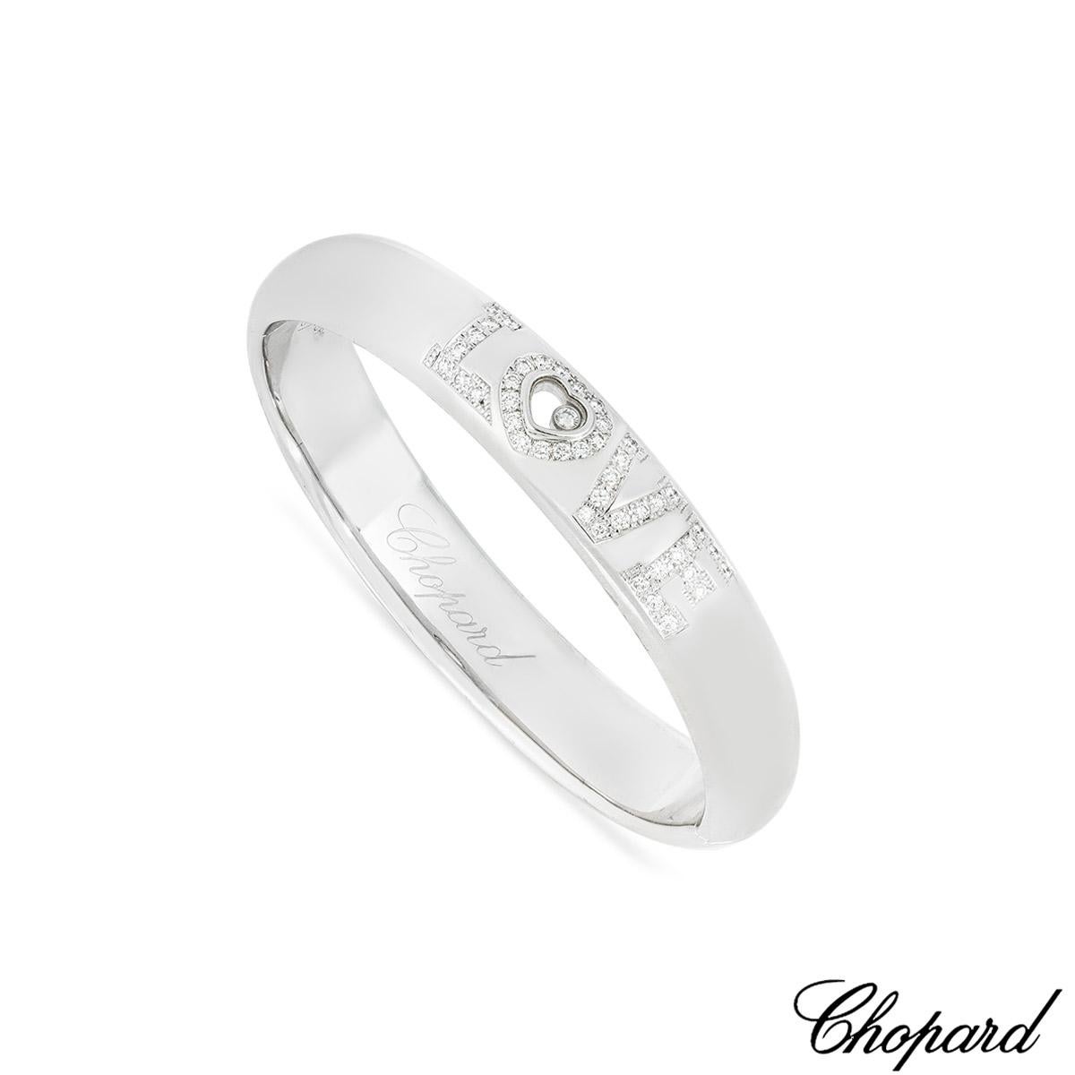 An iconic 18k white gold diamond bracelet from Chopard from the Happy Diamonds collection. The bracelet features the word 'Love' pave set with 43 round brilliant cut diamonds with an approximate total weight of 0.86ct, F-G colour and VS clarity. The