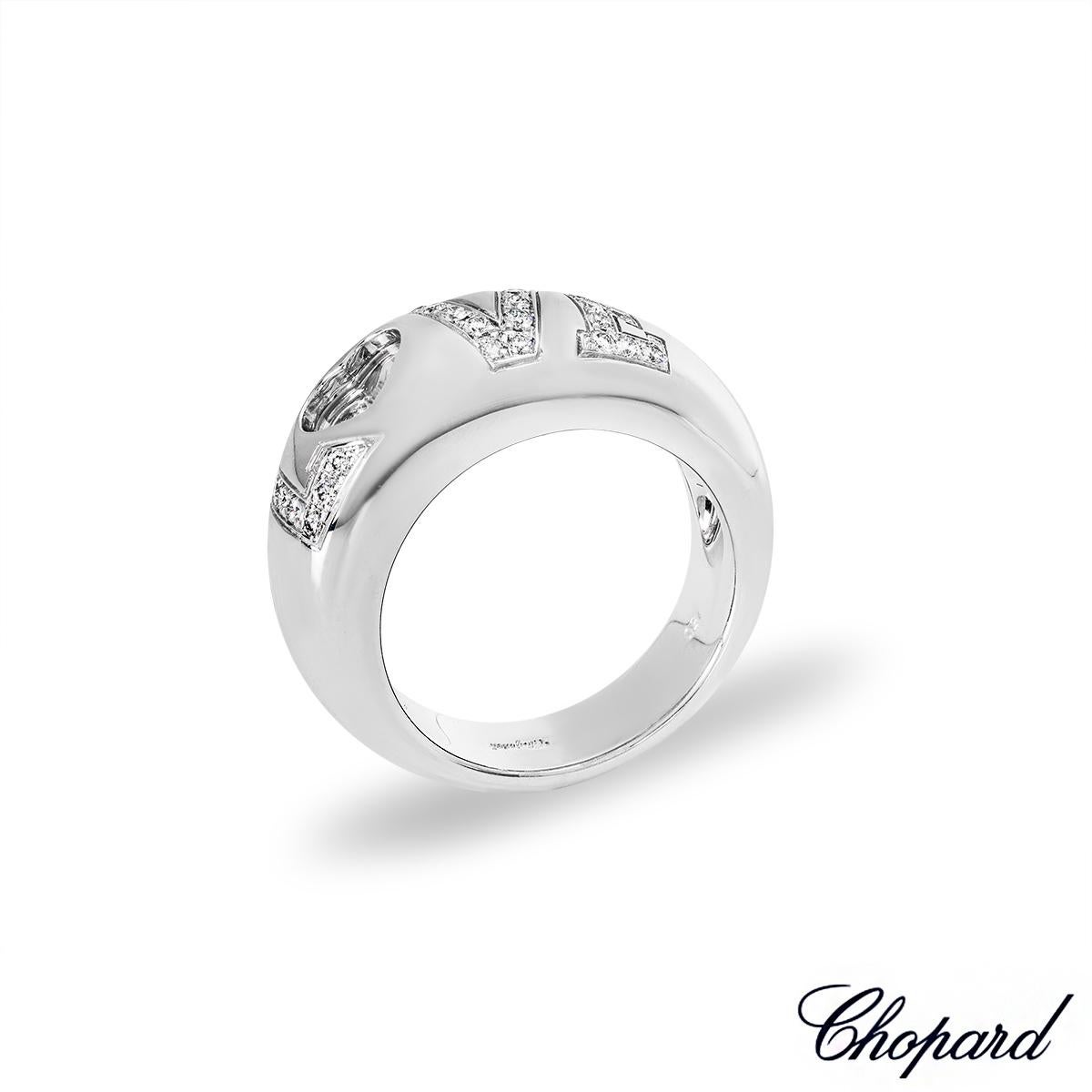 A lovely 18k white gold diamond ring by Chopard from the Happy Diamonds collection. The ring features the word 'Love' pave set with 28 round brilliant cut diamonds with an approximate total weight of 0.30ct, F-G colour and VS clarity. The 'O' is in