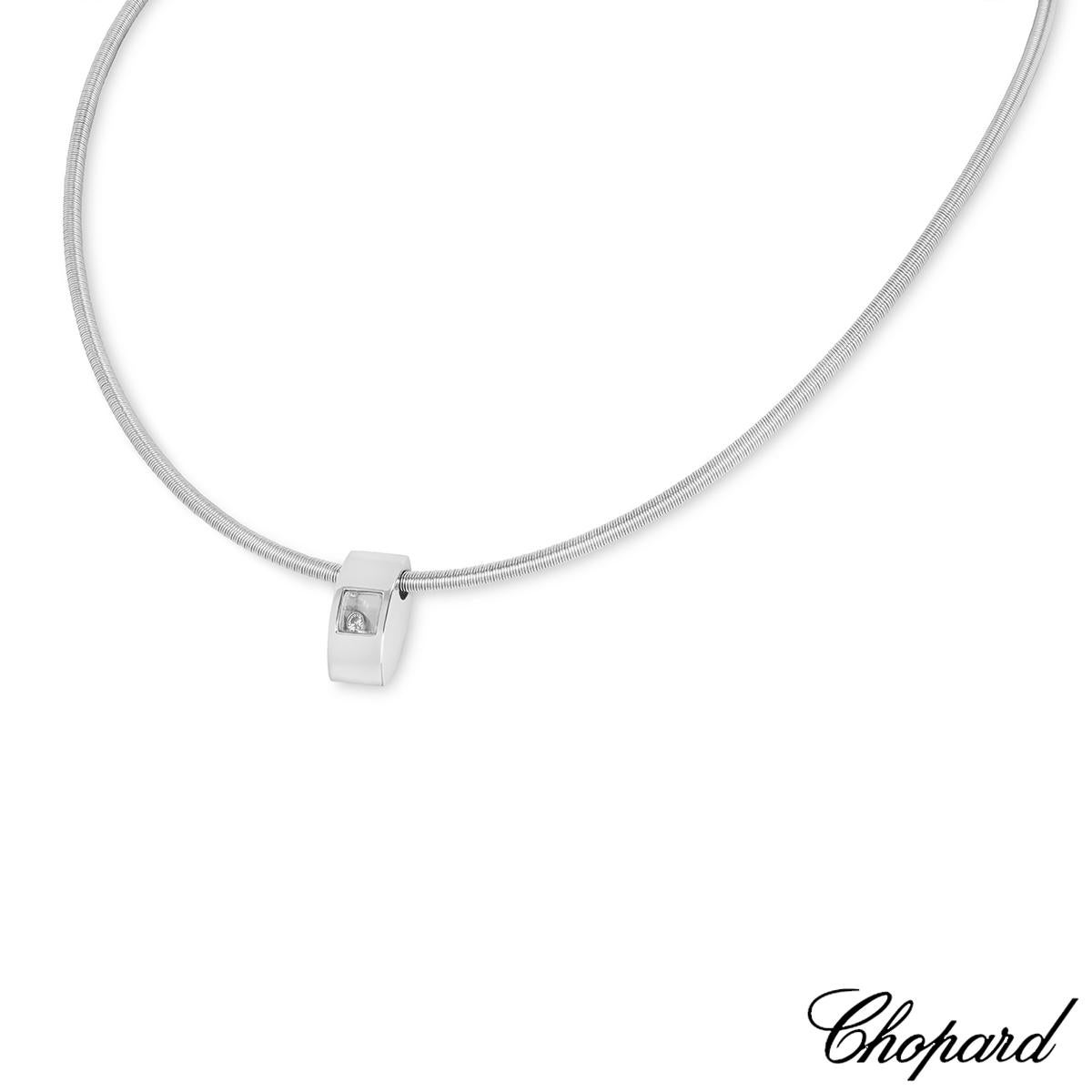 A lovely 18k white gold pendant by Chopard from the Happy Diamonds collection. The pendant features a single floating round brilliant cut diamond encased behind the iconic Chopard signed glass. The pendant measures 16mm in length and 8mm in width,