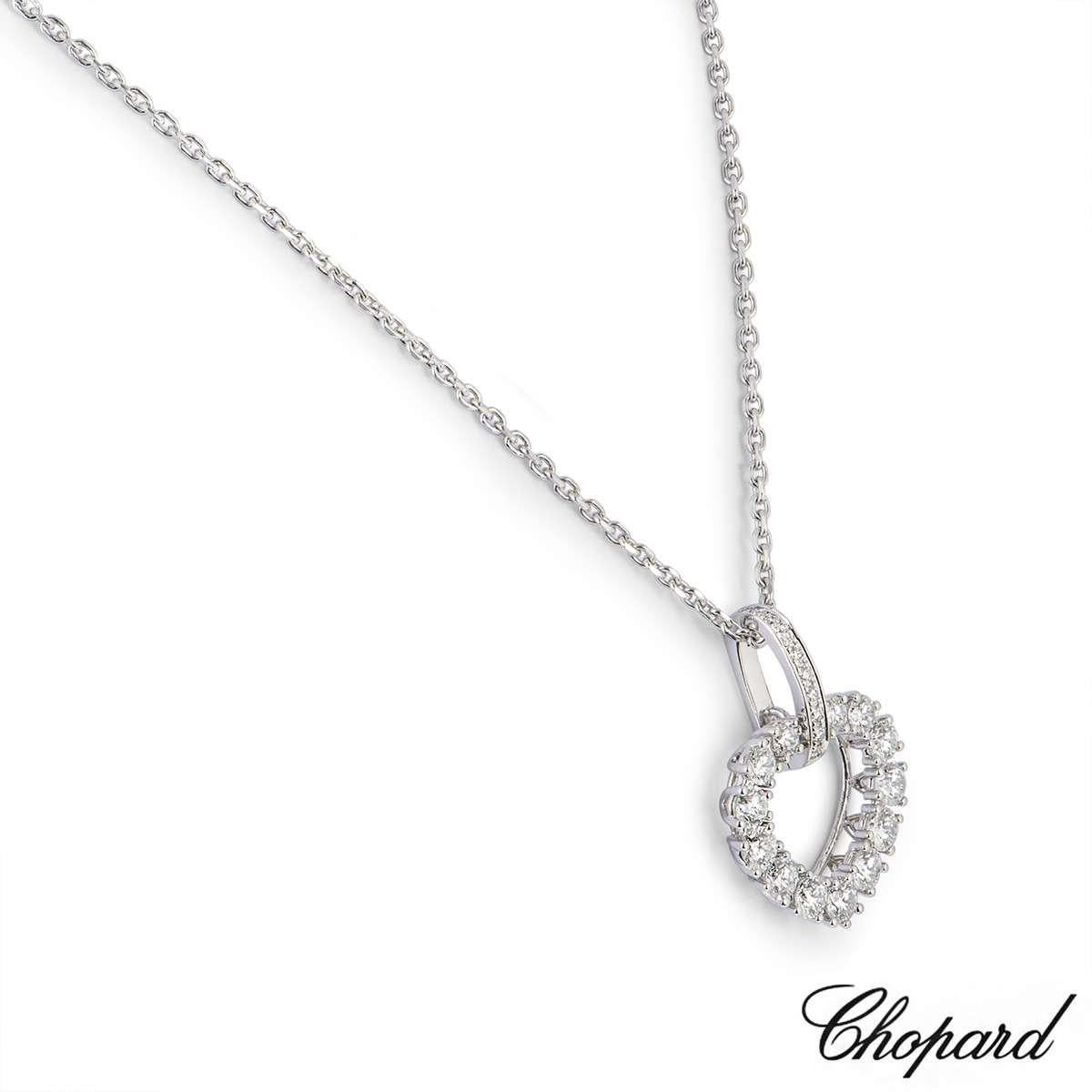 A beautiful 18k white gold pendant from the L'heure Du Diamant collection by Chopard. The pendant features an openwork heart with claw set diamonds totalling 0.70ct. The pendant comes on an original 16 inch Chopard necklace with a lobster clasp. The