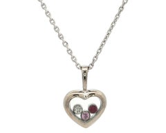 Chopard Collana con ciondolo a cuore in oro bianco con diamante e rubino Happy Diamond Icon