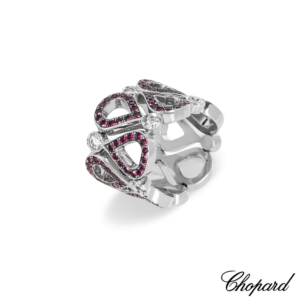 A chic 18k white gold ruby and diamond Chopard Pushkin ring. The ring features the Pushkin design pave set with 126 round cut rubies with an approximate weight of 1.28ct and displaying a deep pinkish-red hue. Bezel set to the points of the rubies