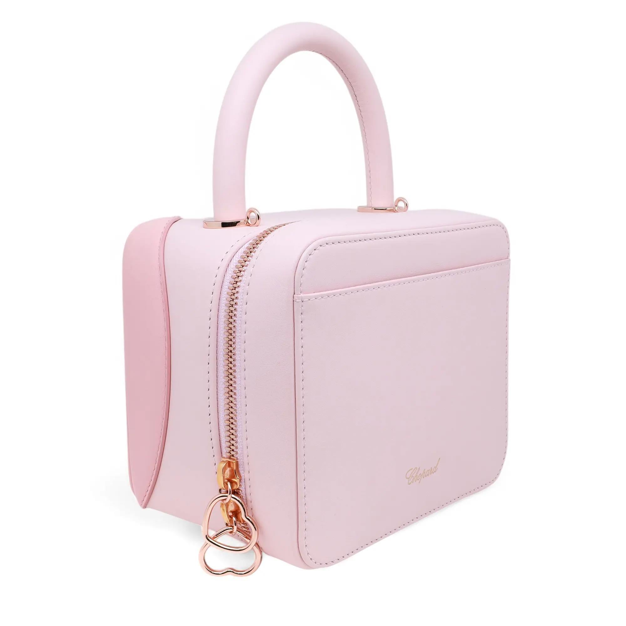 Chopard x Chloë Sevigny leather shoulder bag, model number 9500-0982. This brand-new item comes in pink calfskin leather with a detachable metal chain crossbody strap. This exquisite Italian handbag is the result of a collaboration between actress