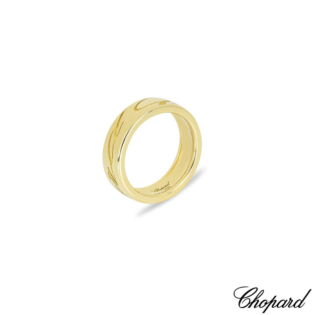 A charming 18k yellow gold Chopard ring from the Chopardissimo collection. The 6mm wide band is engraved Chopard in a calligraphy style throughout the ring. It is a UK size N/ US size 6 1/2/ EU size 53 and has a gross weight of 8.15 grams.

Comes
