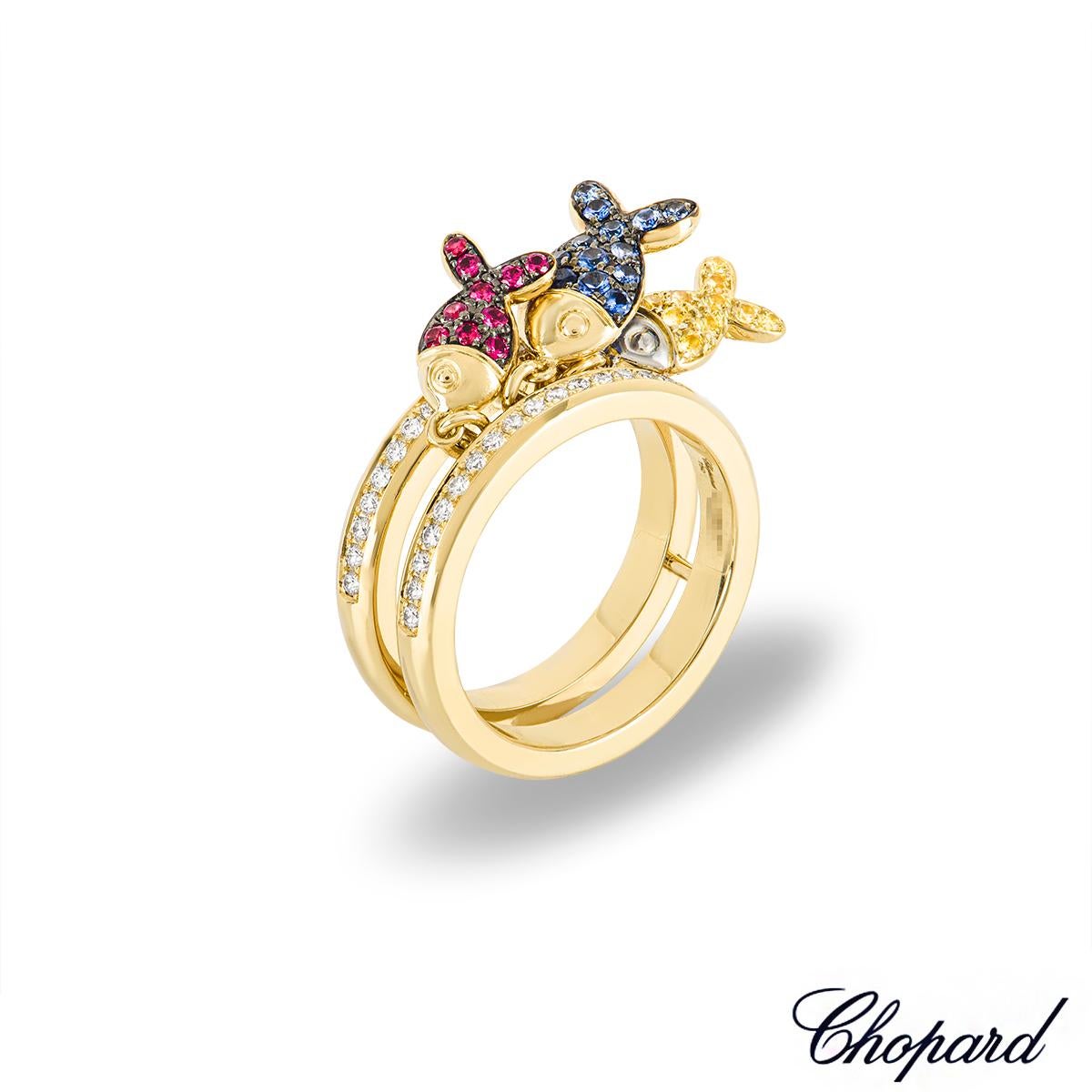A unique 18k yellow gold dress ring by Chopard. The ring comprises of two 3mm bands evenly separated by 5 bars between them. The bands are each pave set with 20 round brilliant cut diamonds with a total weight of 0.40ct. Adorning the centre of the