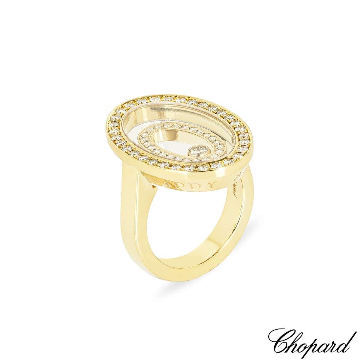 An enticing 18k yellow gold diamond ring by Chopard from the Happy Spirit collection. The ring features an oval motif set to the centre with a round brilliant cut diamond in a bezel setting, weighing approximately 0.07ct, G colour and VS clarity.