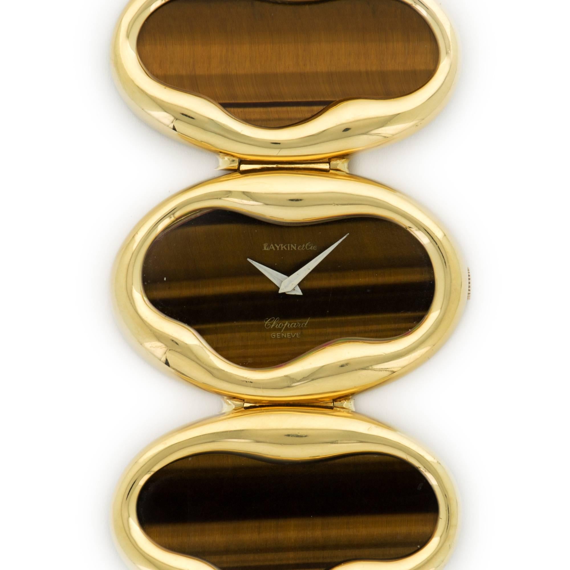 An Extraordinary and Substantial 18k Yellow Gold Bracelet Watch with Inlaid Tigers Eye, By Chopard. Circa 1975. A Truly Unique and Rare Timepiece. Originally Retailed by Laykin et Cie. What an Amazing Piece!