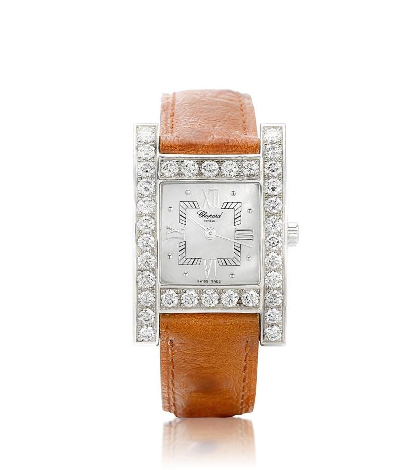 The square mother-of-pearl dial applied with Roman and dot numerals, to the bezel pavé-set with brilliant-cut diamonds, joined by Black Alligator Strap, to the gold buckle, mounted in 18 karat white gold, quartz movement, dial and case signed