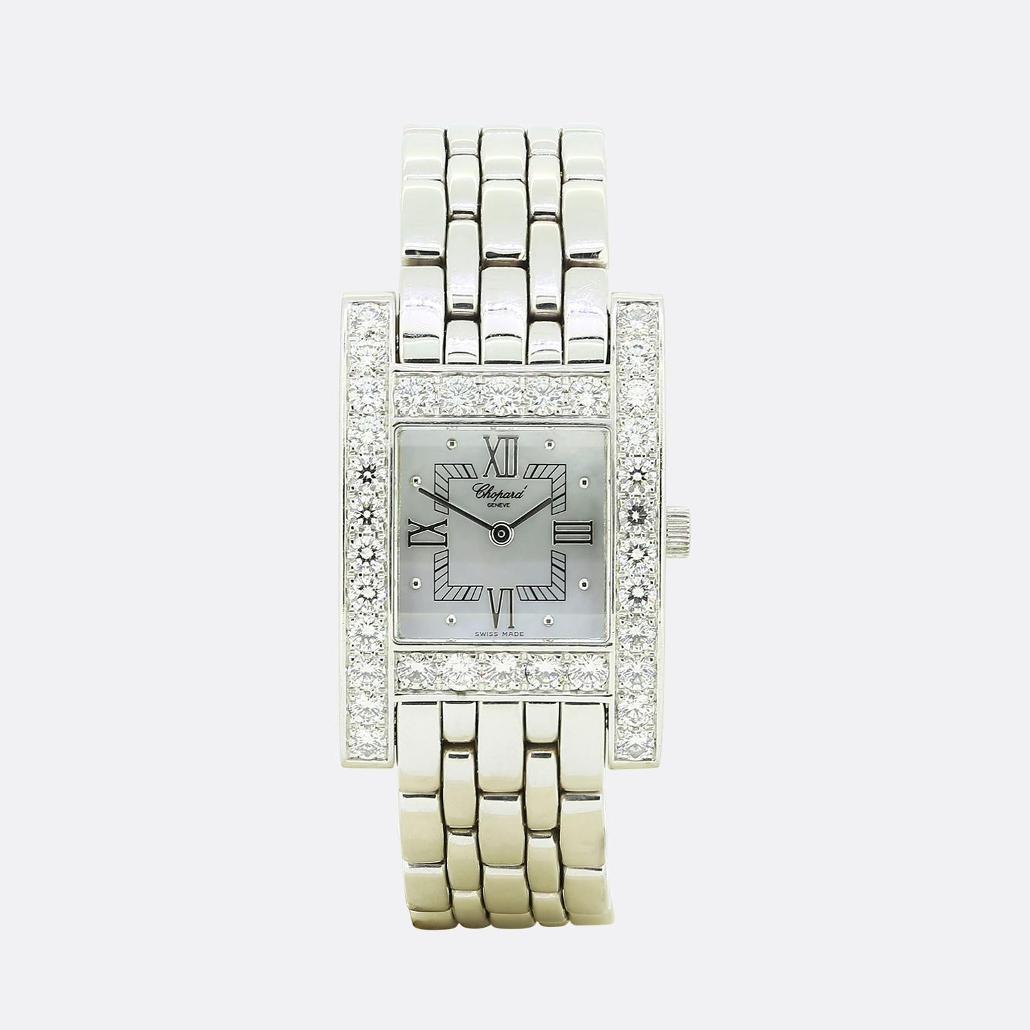 Here we have a wonderful 18k white gold Chopard H Your Hour wristwatch. The watch features a mother of pearl dial with Roman numerals and 34 bezel set round brilliant diamonds. The 18k white gold bracelet, features a 18k white gold jewellery style