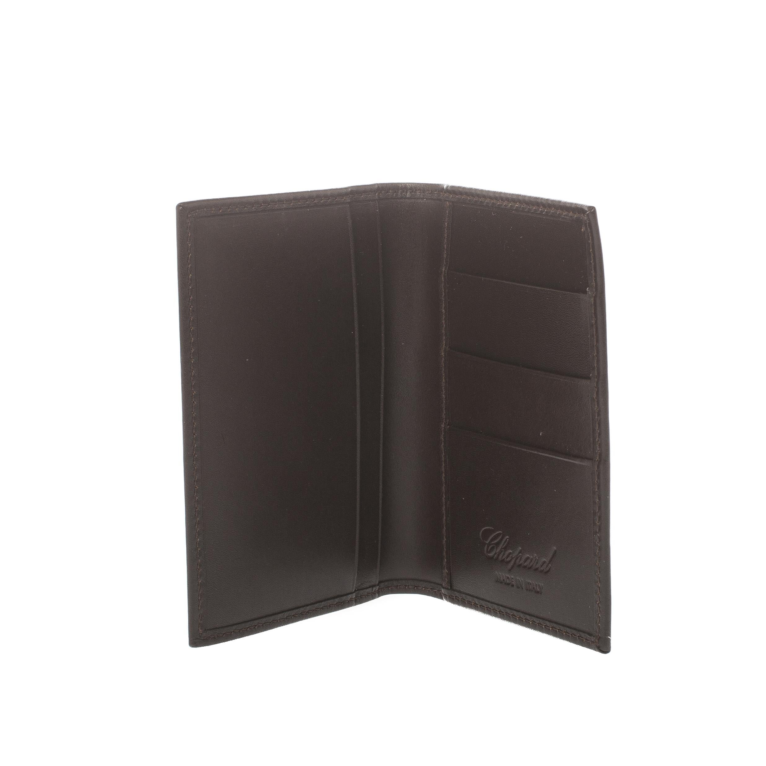 Store your essentials effortlessly in this sturdy leather wallet. Styled as a bi-fold this suave creation is from the house of Chopard. Featuring a rich brown shade, this wallet is a stylish accessory.

Includes: Original Box

