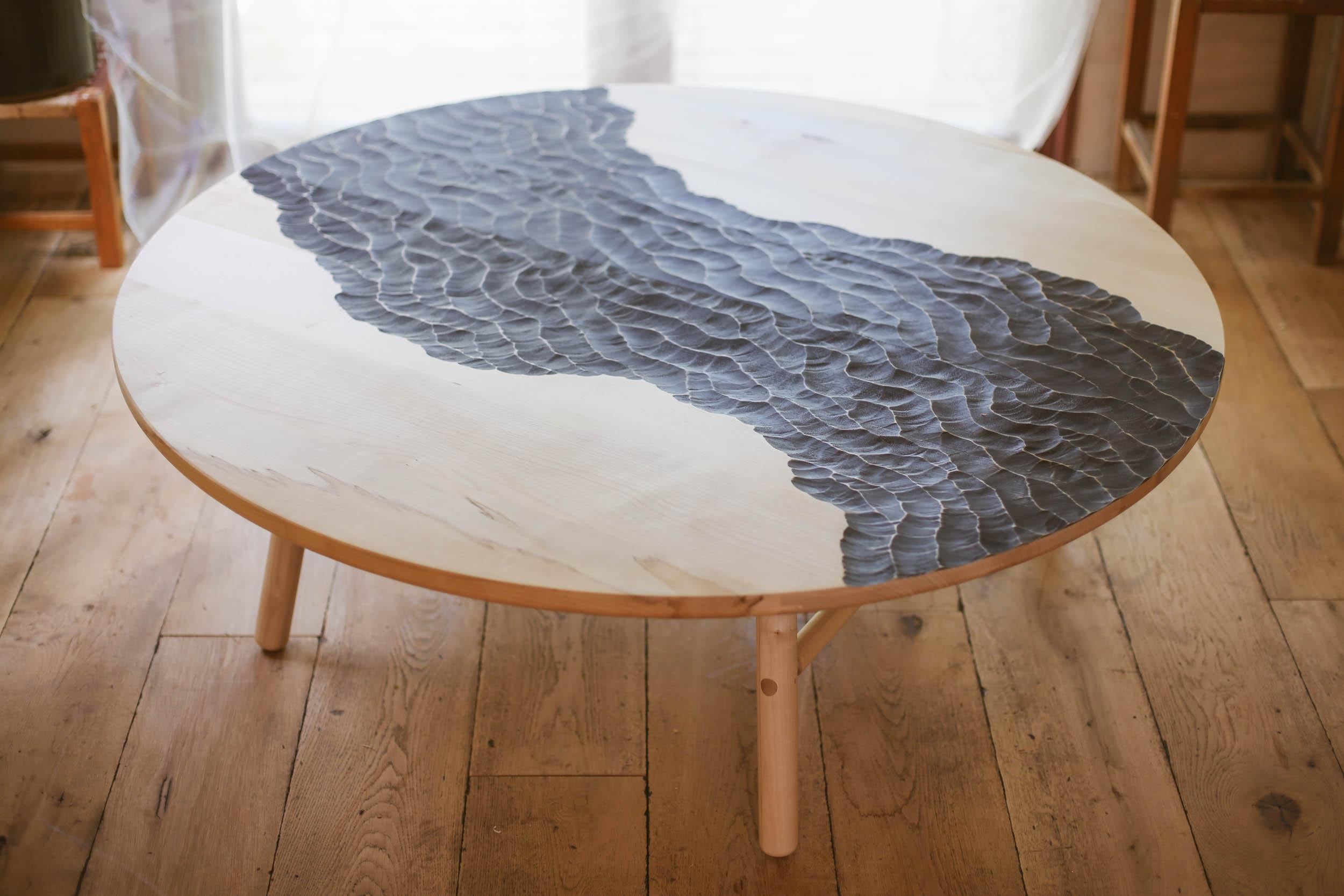 Choppy Watters Coffee Table by Temper Studio
Dimensions: D 120 x W 120 x H 40 cm.
Materials: Wood.

A beautifully detailed, ebonised, and sumptuously carved coffee table etched with a wild river running through it, this is one of our favourite