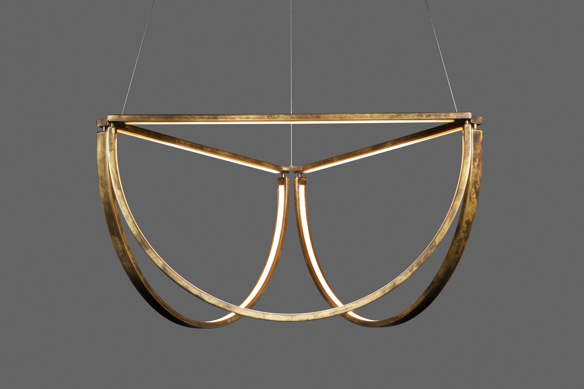 The Chord Cluster, the latest member of the Chord Collection, is a modern reinterpretation of the first Chord pendant. When grouped together, the semi-circles are reminiscent of the bowed curves of a traditional crystal chandelier. Like its