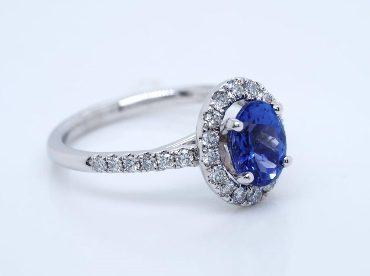 Number of Diamonds  28
Main Stone Color Blue
Secondary Stone  Diamond
Main Stone  Tanzanite
Ring Size 7
Main Stone Shape  Oval
Style  Halo Ring
Base Metal  Platinum
Gemstone Clarity Grade  Eye Clean
Number of Gemstones  1
Sizable  Yes
Total Carat