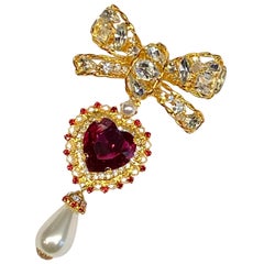 Chris Crouch, Moans Couture, 5" long gold 
rhinestone bow heart pendant brooch