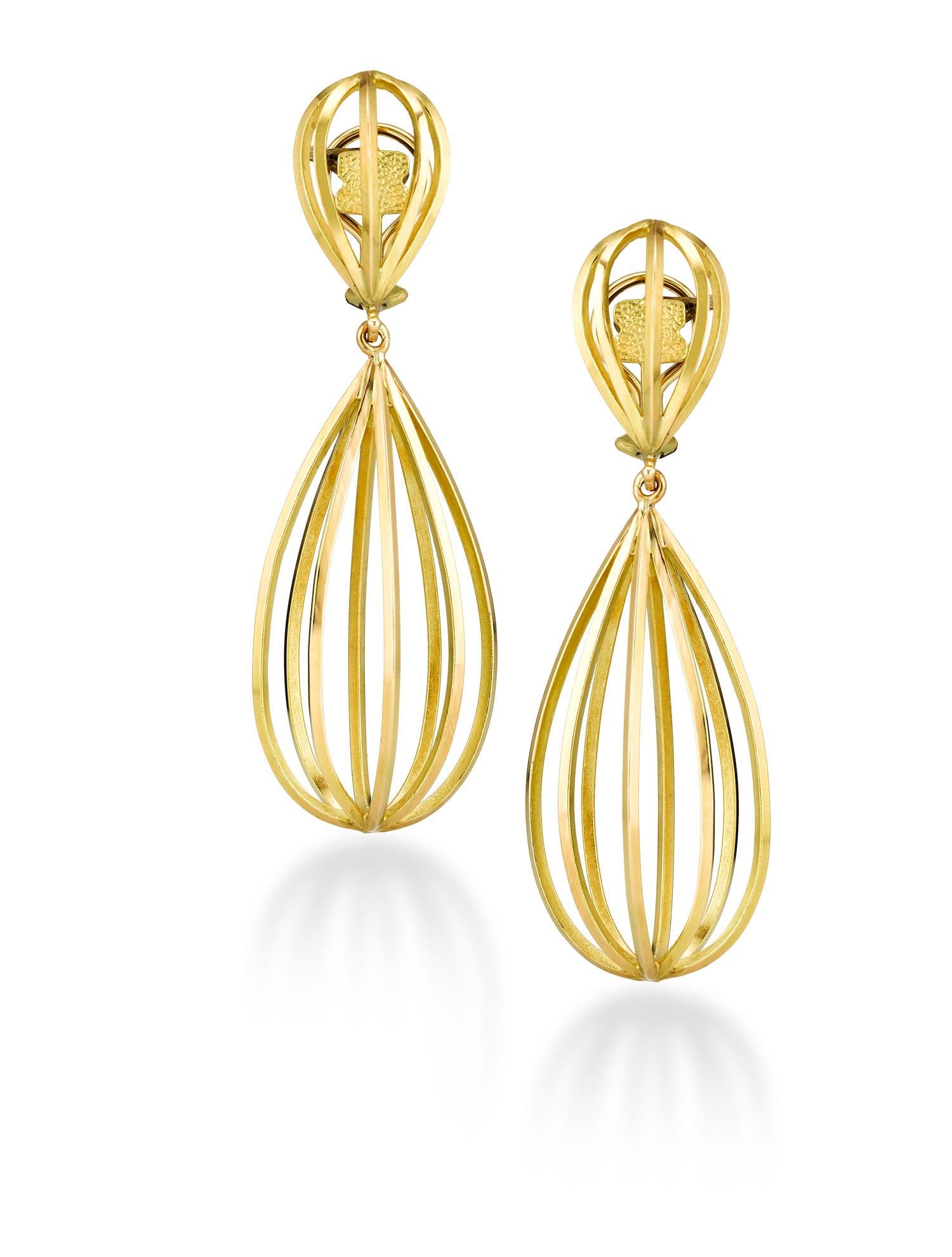 Architectural ear pendants in 18k yellow gold. Inspired by the spectacular cross beams of gothic ceilings of medieval architecture, these earrings are decidedly modern. Clip on with french backs. A post can be added. 
