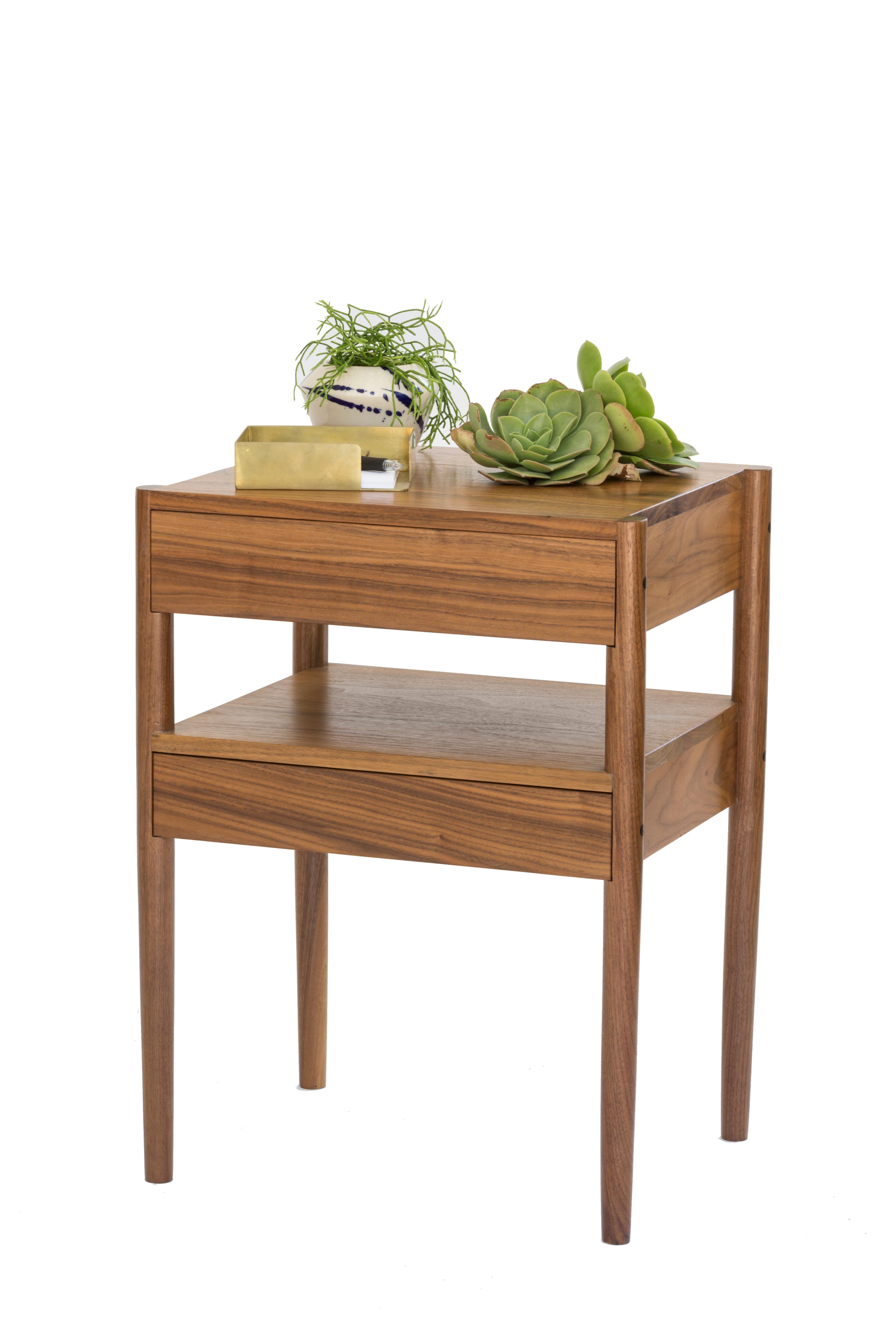 Open up its two floating slow closing drawers to stow away all your bedside essentials. This nightstand is solid wood constructed, with turned legs, and handcut joints.

Wood options are natural oak, ebonized oak, or walnut. We can also make the