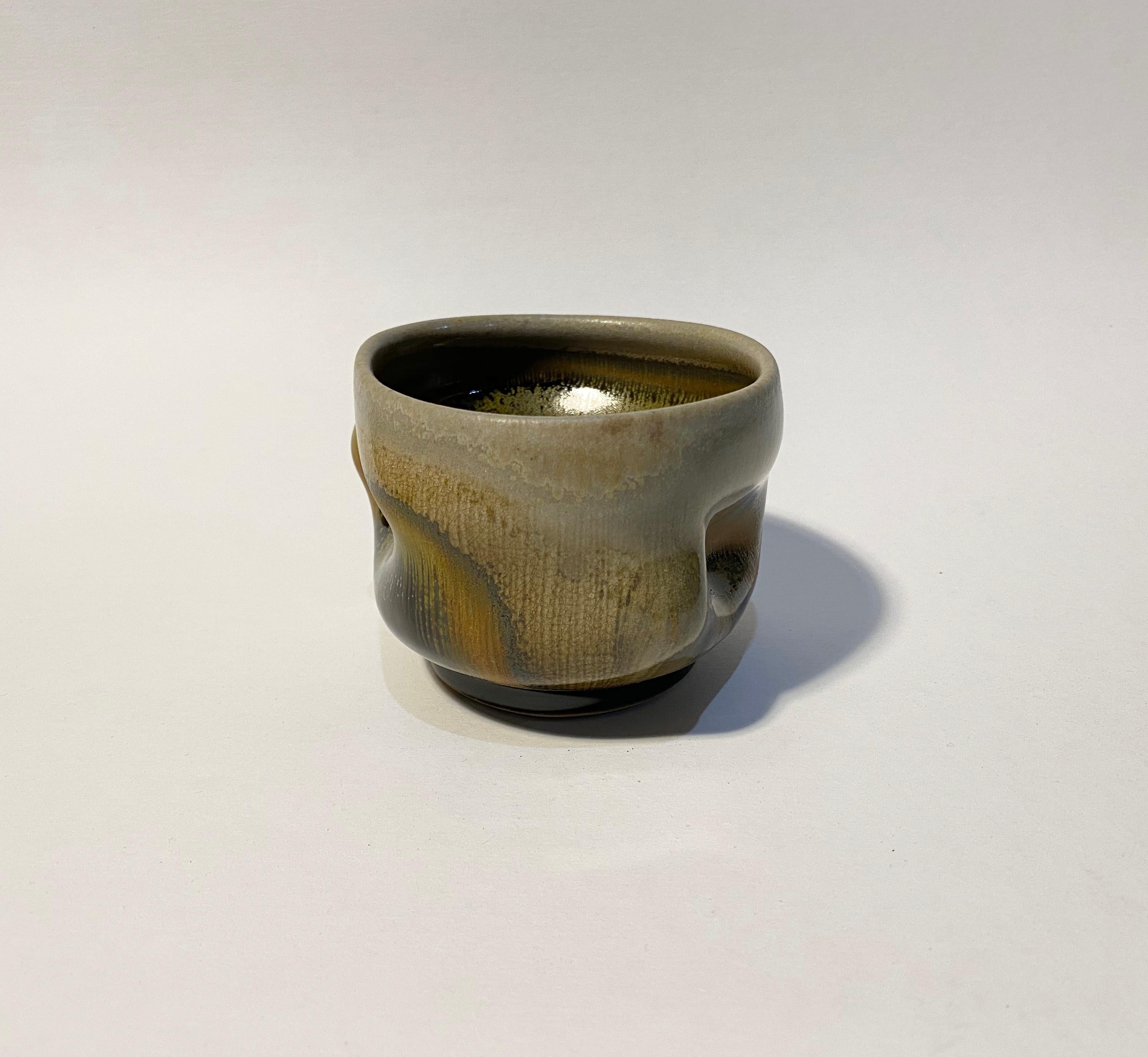 Chris Gustin (born 1952)
Whiskey Cup, 2019
Stoneware
Size: 3 x 4 x 3.75
Anagama wood fired
Signed on the underside with the artist's device

Chris Gustin is a studio artist and Emeritus Professor at the University of Massachusetts, Dartmouth.