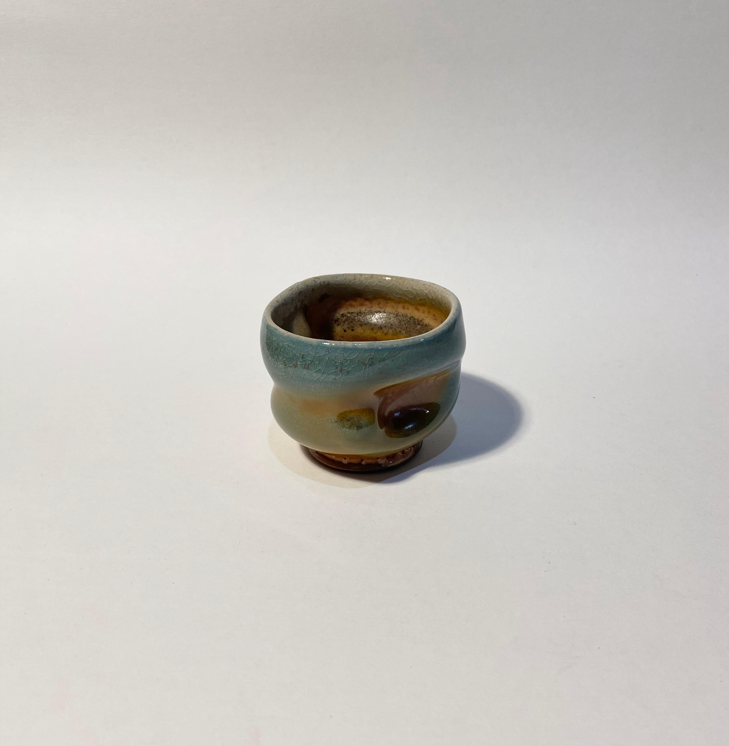 Chris Gustin (born 1952)
Whiskey Cup, 2019
Stoneware
2 1/2 x 3 3/8 x 3 1/4 inches
Anagama wood fired
Signed on the underside with the artist's device

Chris Gustin is a studio artist and Emeritus Professor at the University of Massachusetts,