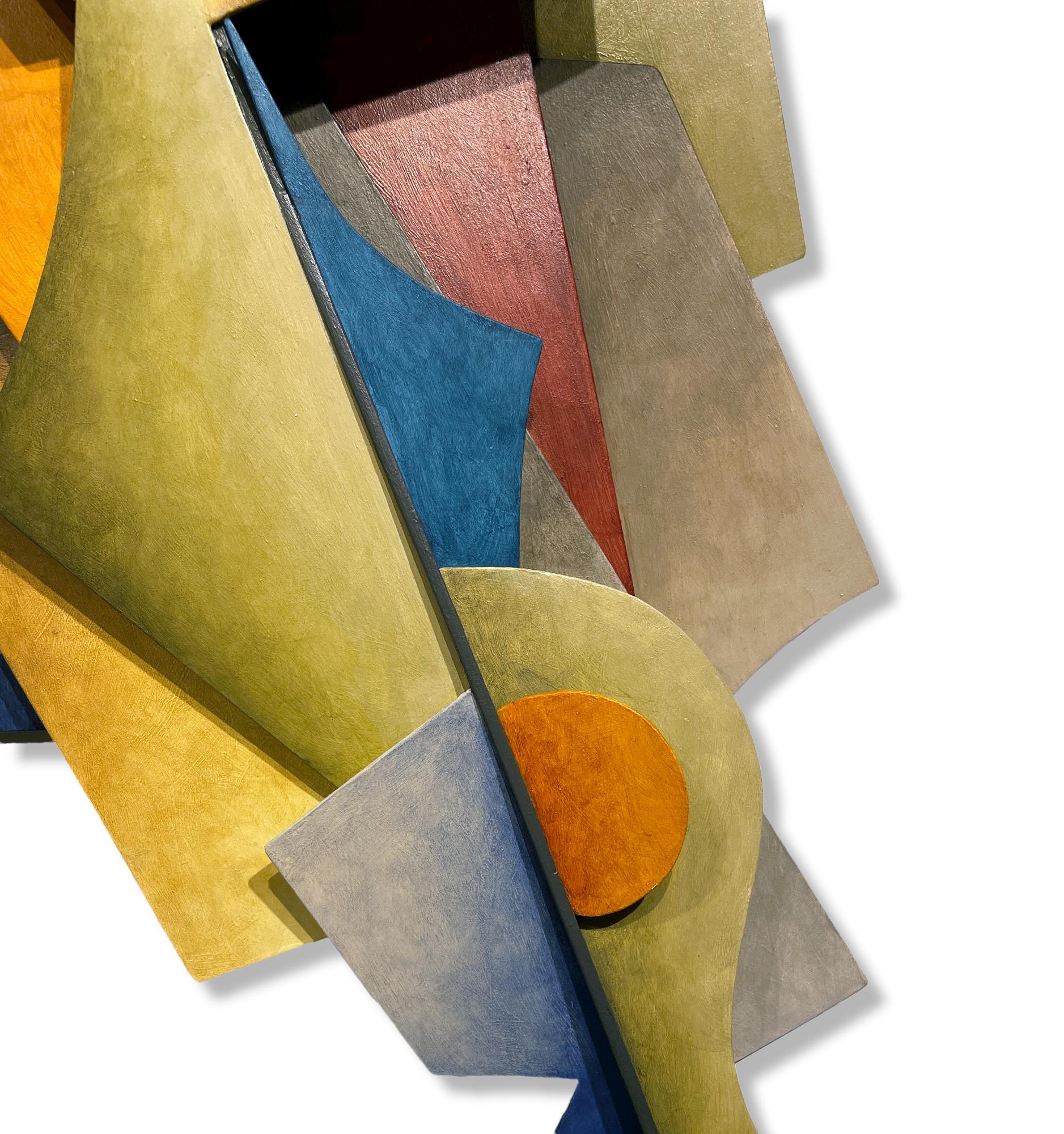 This dynamic wall sculpture is created from sheets of steel, welded together in an abstract geometric pattern.  Earth tones of blue, orange, purple and yellow dominate and are balanced by softer hues. While the work adheres to a rigid, rational