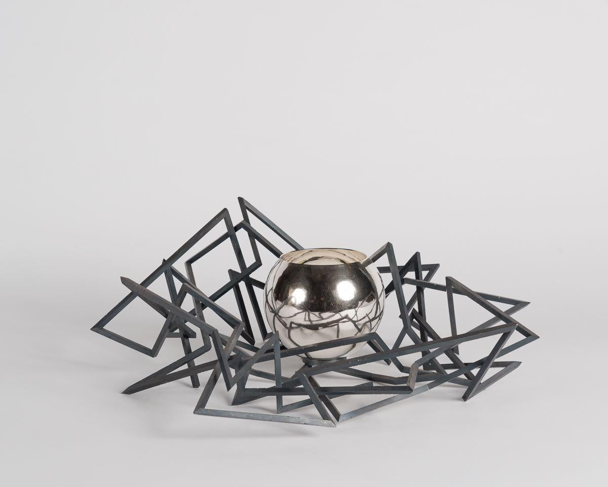 This piece shows Chris Knights's continued exploration of silver as he challenges its use; turning away from the material's traditional application and using its qualities to freely explore form and sensory ranges of provocation and attraction,