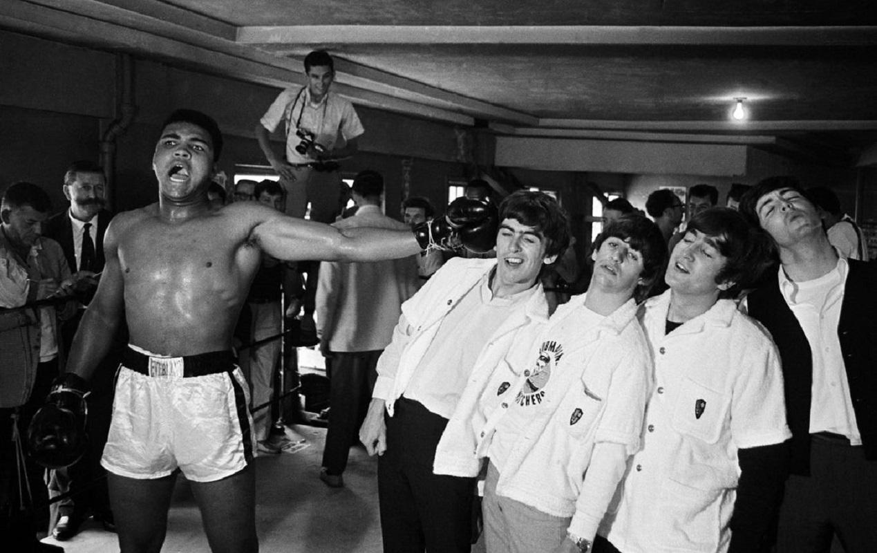 "Ali Versus Moptops" by Chris Smith

American heavyweight boxer Cassius Clay (later Muhammad Ali) takes on the Beatles (from left to right, George Harrison, Ringo Starr, John Lennon and Paul McCartney) in Miami, during the run-up to his title fight