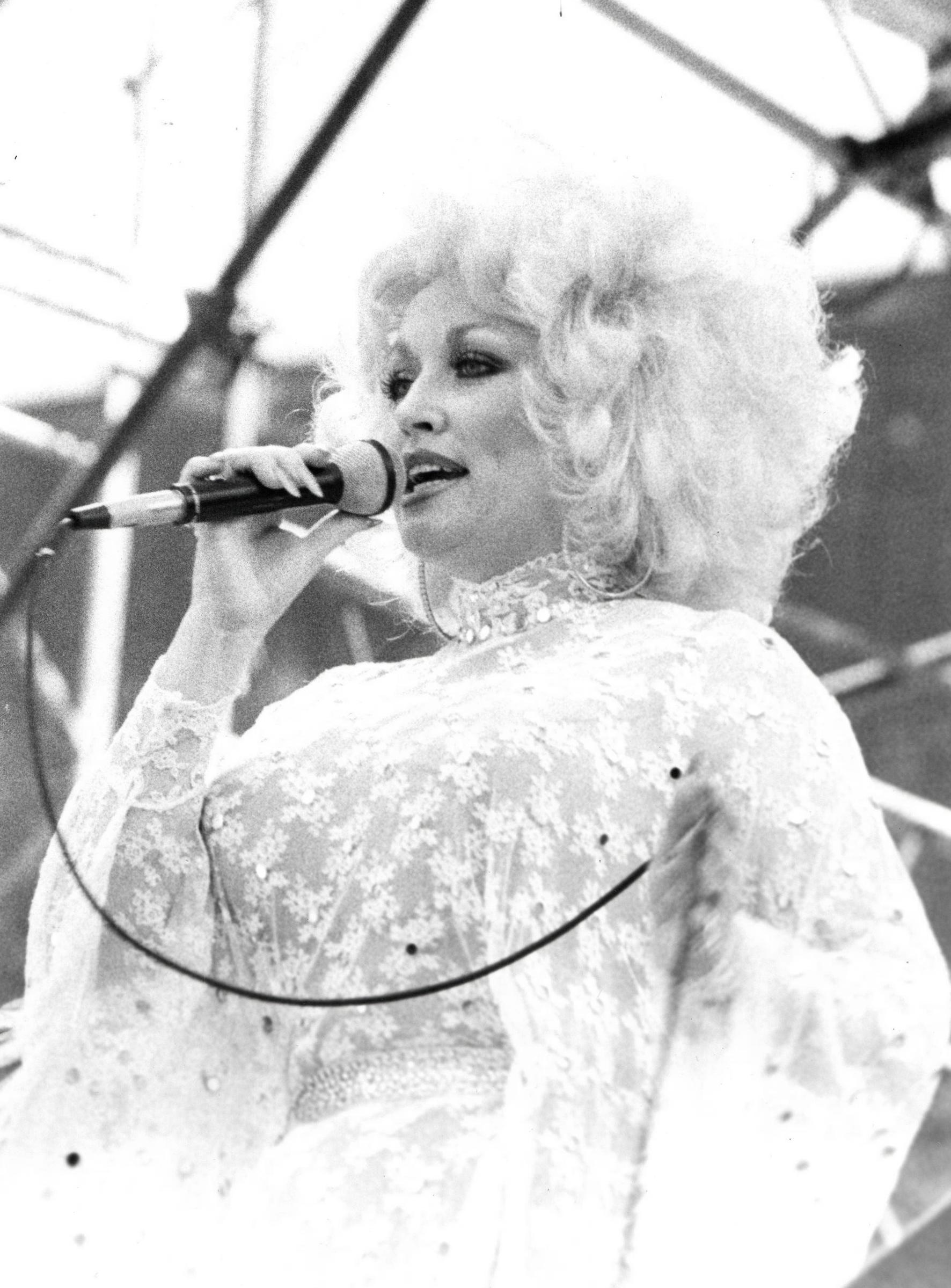 Chris Walter Portrait Photograph - Dolly Parton Singing into Microphone Vintage Original Photograph