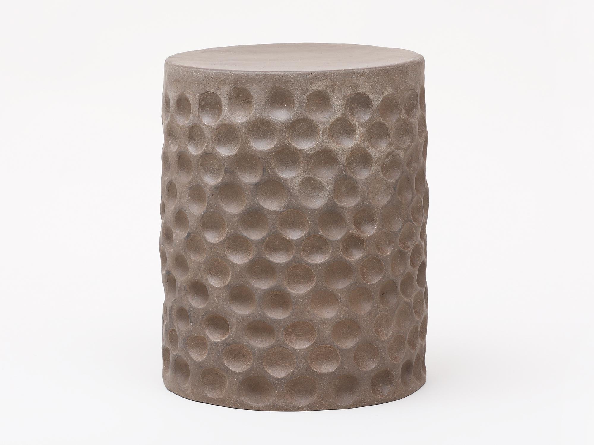 Black stoneware side table or stool, with a flat top and a textural circle pattern on the sides. Handmade in New York by artist Chris Wolston, perfect for indoor or outdoor use. One version is available now, more can be made to order in with an 8-10