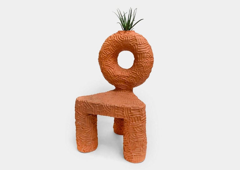 Chair and planter handmade of solid terracotta by New York and Medellín-based artist Chris Wolston. Can be used indoors or outdoors – Please note, this cannot be left outside during the winter months in environments where the temperature falls below