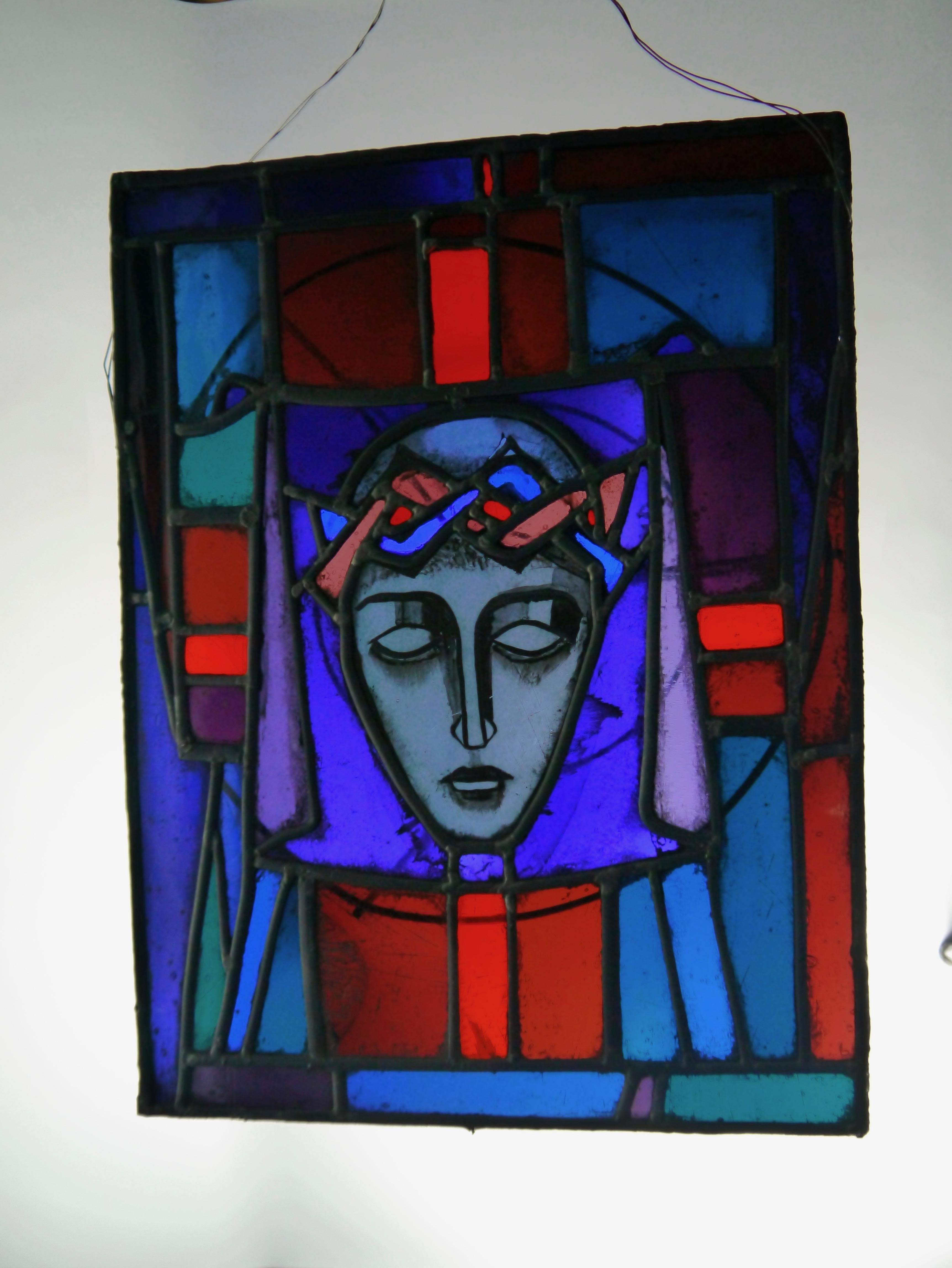 Unique handmade leaded stained glass panel / window, depicting Christ crowned with thorns, made by Norwegian artist Alvi Eliassen in the 1960s. Multiple deep shades of blue, green and red. Prepared to be hung, preferably onto a window, or it can be