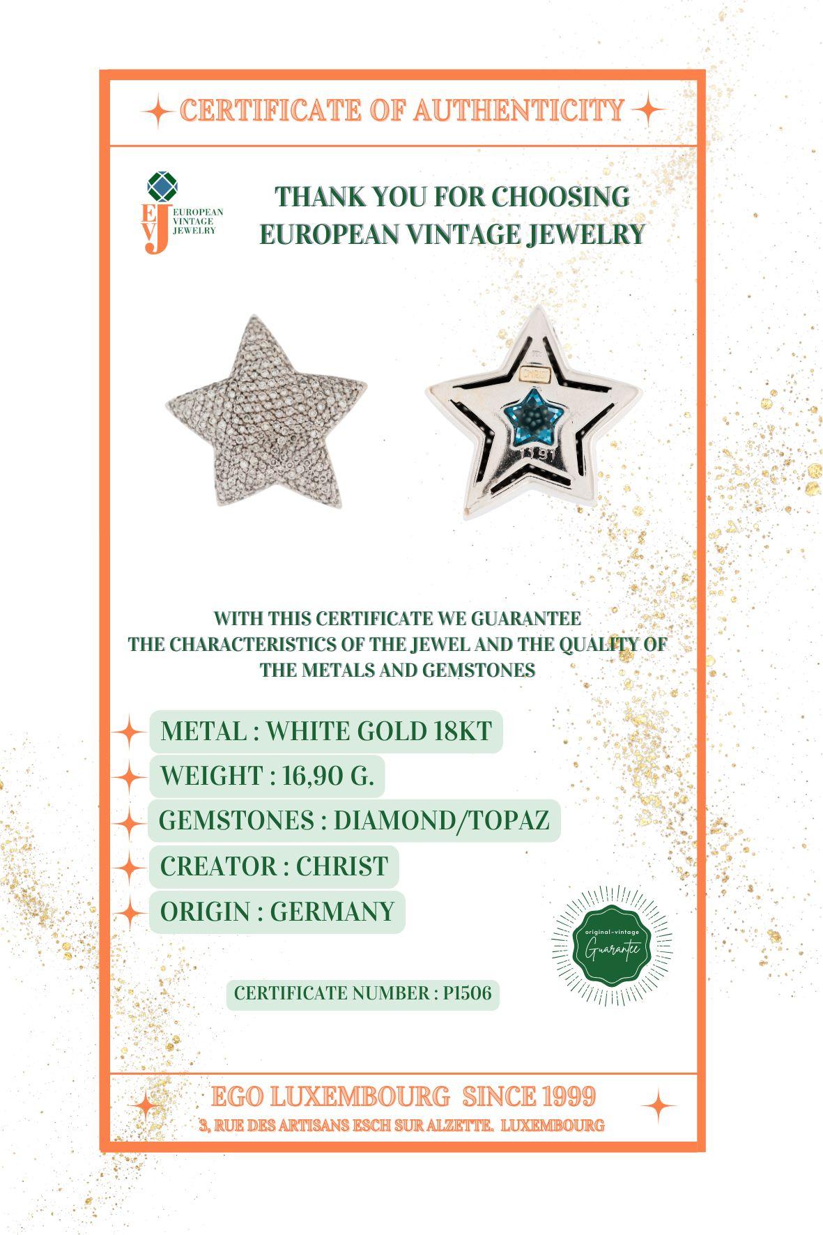 Ciondolo a forma di stella con diamanti e topazio blu 