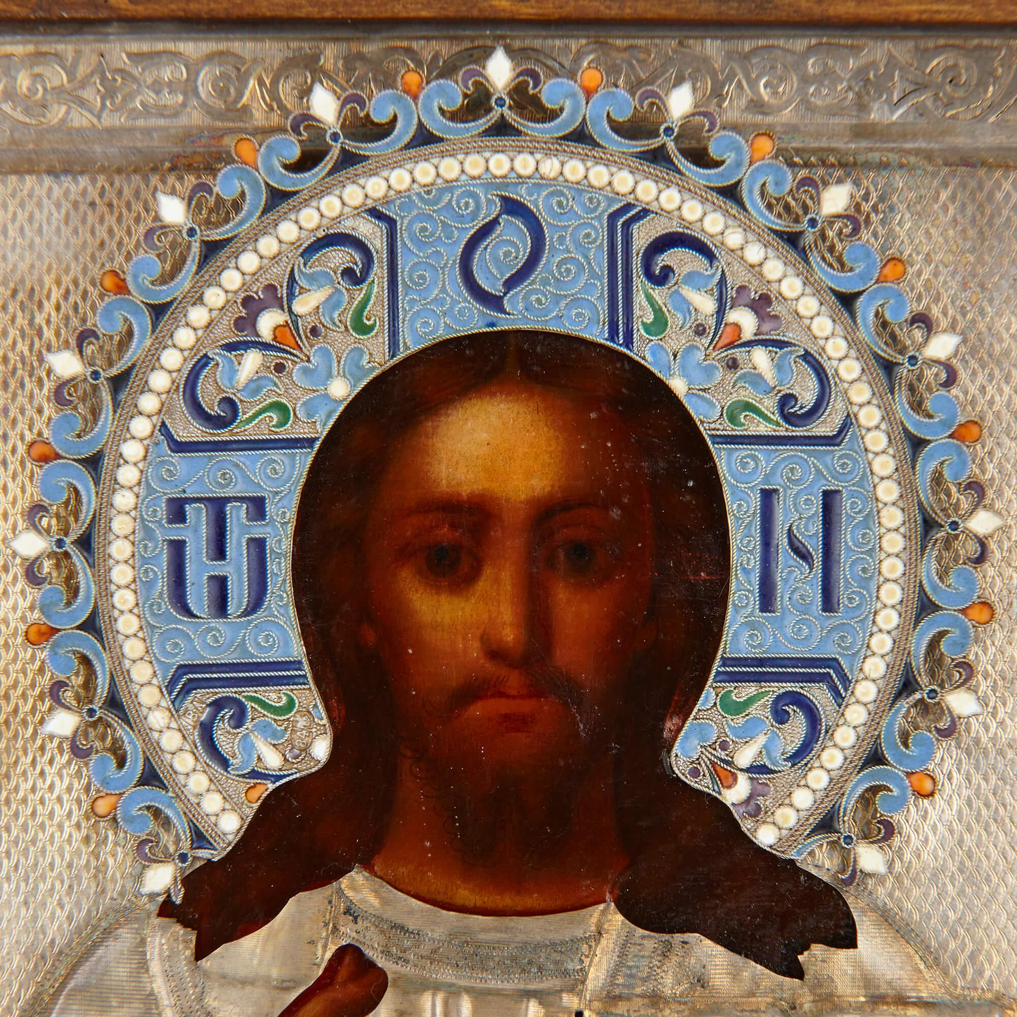 Christ Pantocrator, A silver-gilt and cloisonné Enamel Russian Icon
Moscow, 1892
Icon: 23.5cm high x 20cm wide x 4cm depth.
Case: 26.5cm high x 23cm wide x 7cm depth.

This exceptional piece is a silver and enamel Russian Icon depicting Christ