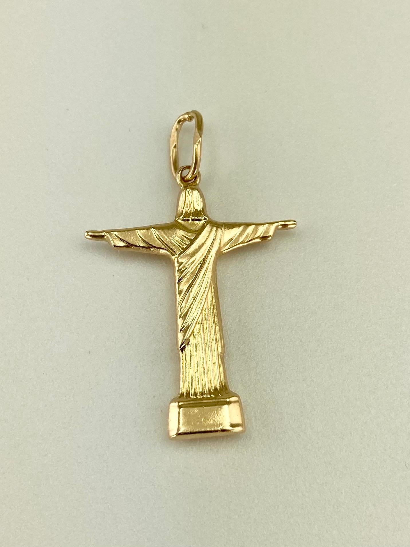 Vintage Christ the Redeemer 18k yellow gold charm pendant, circa ‘1970.

DIMENSIONS: 1-3/8” long with the loop by 7/8” wide.

GOLD:  18k yellow gold 

WEIGHT: 2 grams 