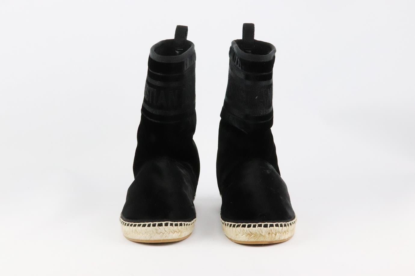 These 'Dior Chez Moi’ boots by Christian Dior are lined in cosy black shearling, this black velvet pair rests on a durable rubber sole and is lightly cushioned for added comfort, they have the Christian Dior logo around the ankle. Sole measures