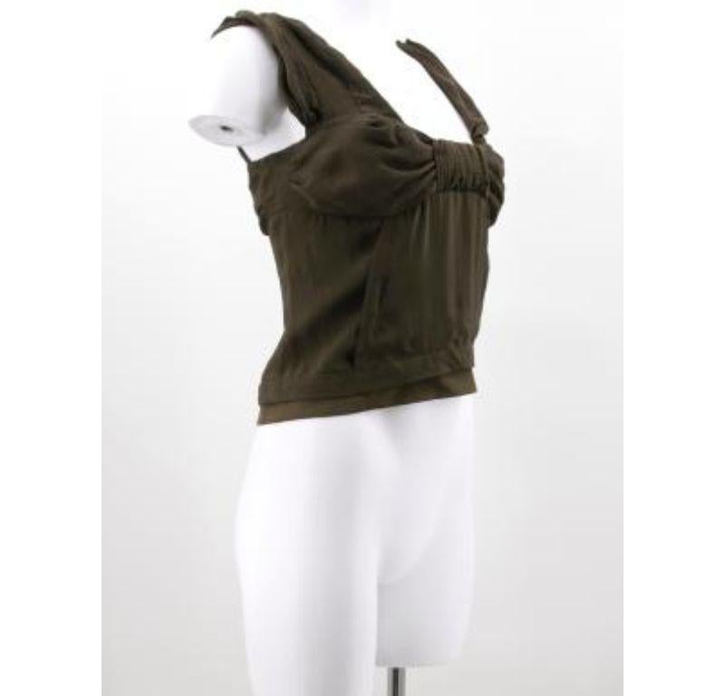 Christain Dior silk blend khaki green vest top with twist detail around bust and back, layered hem and side concealed popper closure.
