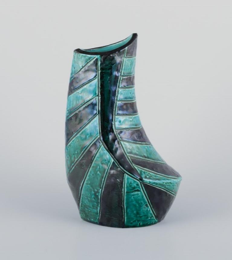 Christer, Mariestad, Sweden. 
Modernist ceramic vase with green and black glaze tones.
Approximately from the 1960s.
Signed.
In perfect condition.
Dimensions: H 21.5 cm x D 13.0 cm.