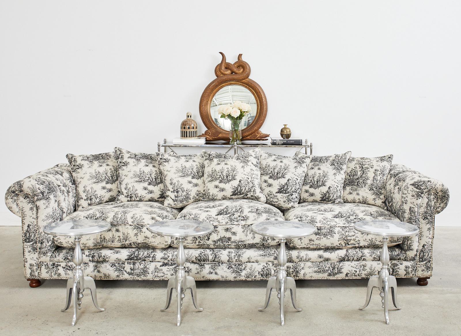 Monumental Grande Dame tufted sofa featuring a toile de jouy French provincial style fabric upholstery. Designed by Christian Audigier (French 1958-2015) for his home in Hollywood, CA. Measuring nearly 10 feet long with a hardwood frame having