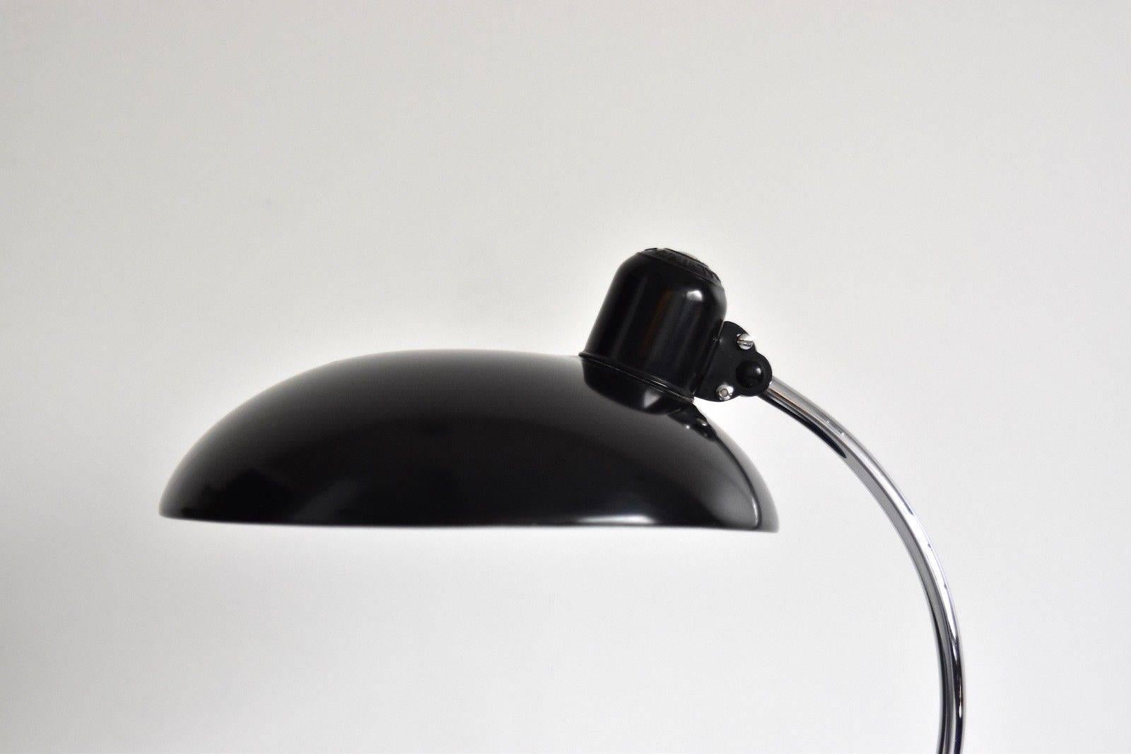 Original Christian Dell desk lamp model 6631 Luxus / president for Kaiser Idell, Germany. Black shade, chrome arm and black base with chrome rim, marked on and in the shade. Arm and shade adjustable. With E26/27 Edison socket. Very nice original