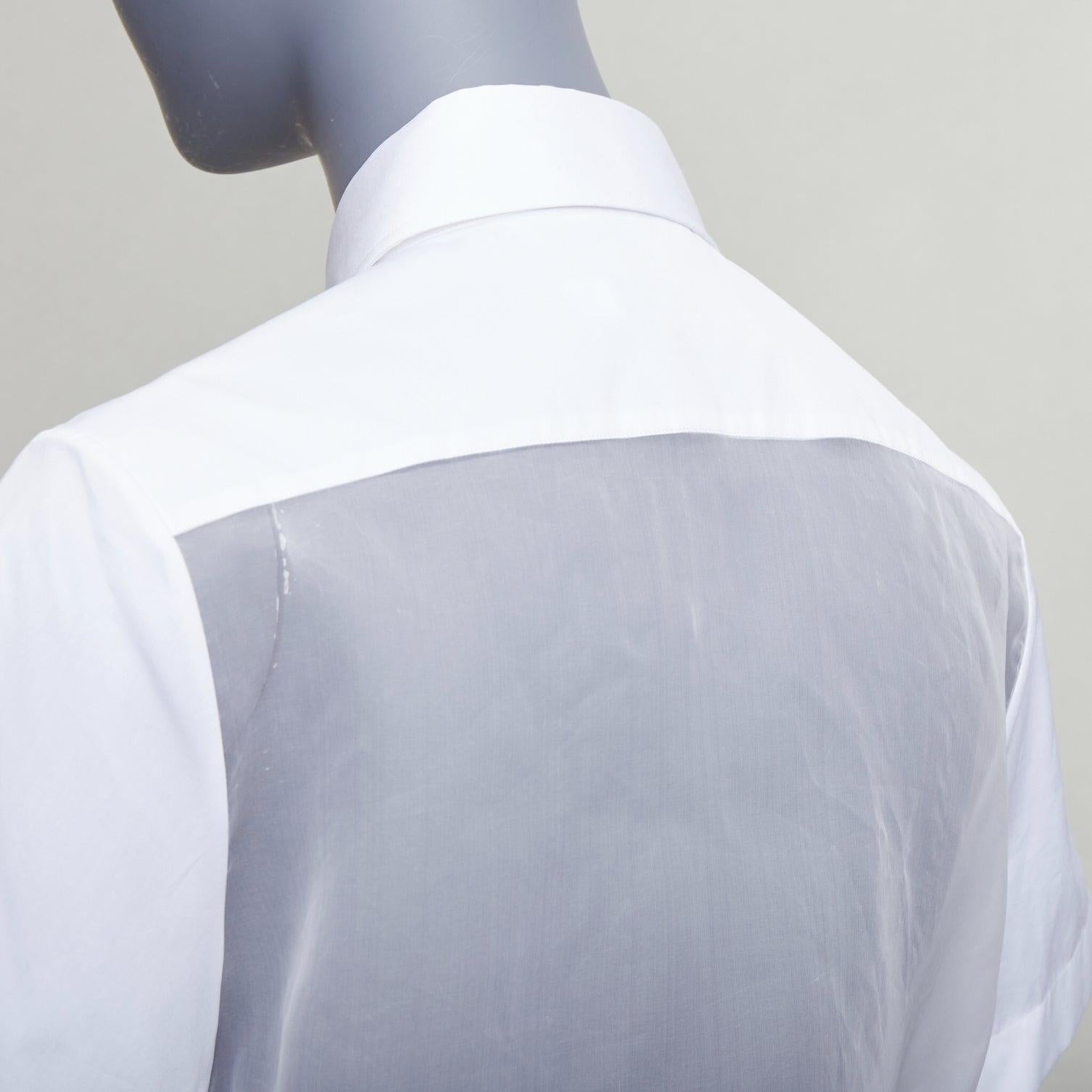 CHRISTIAN DIOR 100% silk white cotton trim sheer panel logo shirt FR34 XS
Reference: AAWC/A01364
Brand: Dior
Designer: Maria Grazia Chiuri
Material: Silk, Cotton
Color: White
Pattern: Solid
Closure: Button
Made in: Italy

CONDITION:
Condition: