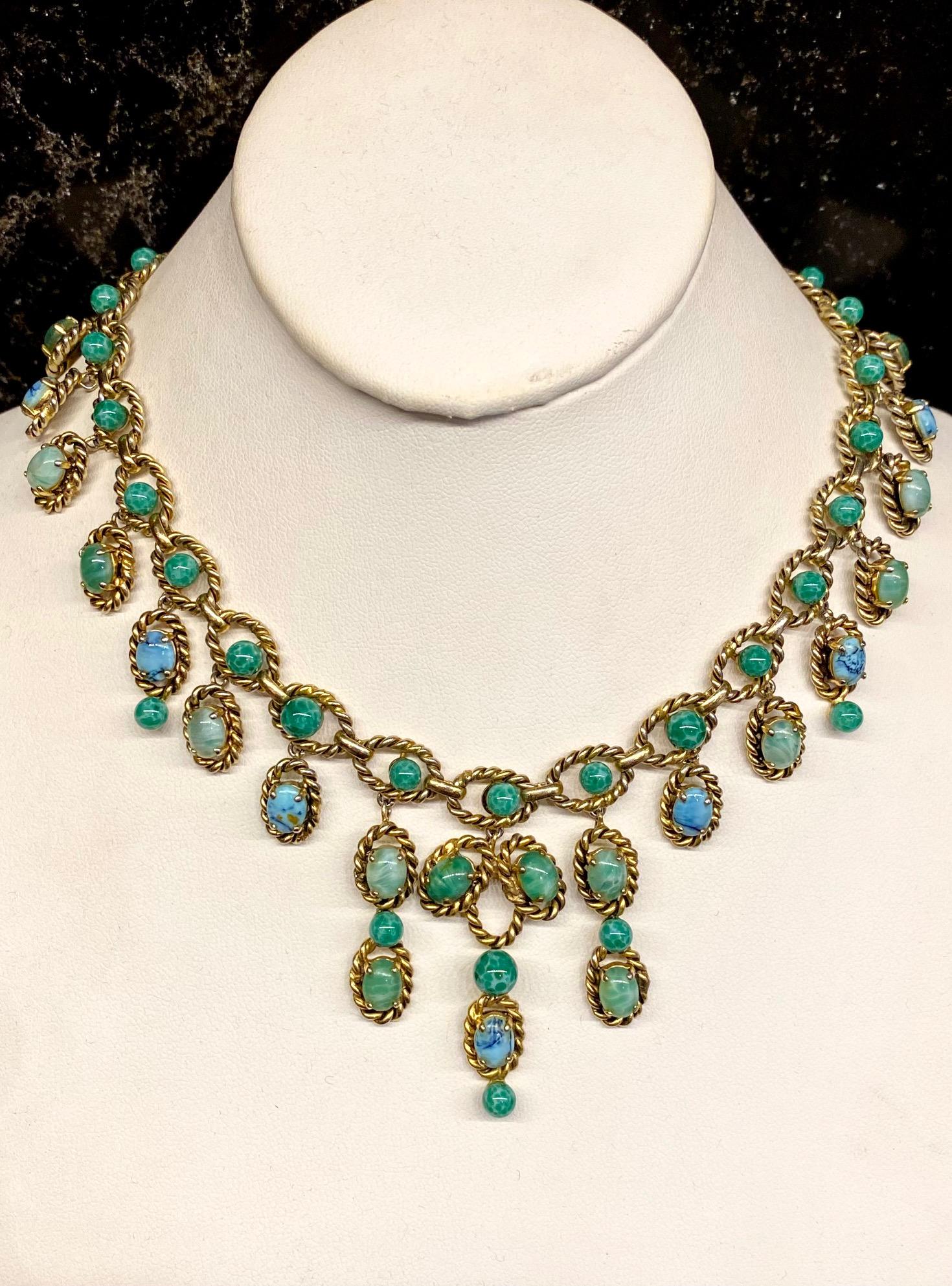 A stunning and rare Christian Dior necklace from 1963. The necklace was made by the company Henkel & Grosse' of Germany who began producing jewelry for Dior in 1955 and continues today. The necklace features oval gold rope twist links with an