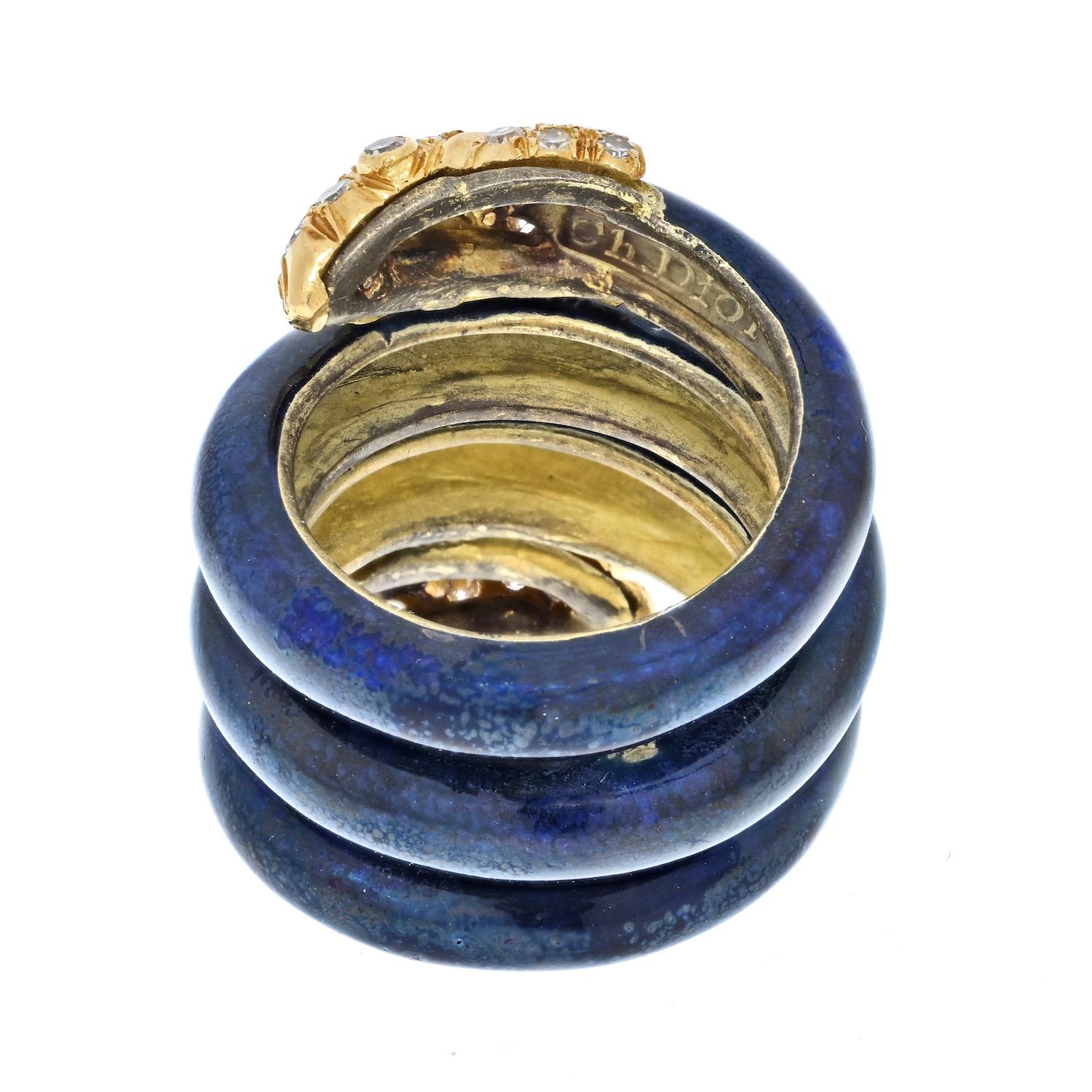 
Circa 1960s, 18k, Christian Dior, Italy. This spectacular snake ring from the renowned fashion house Christian Dior is redolent of mod sixties fashion. Bold in proportion and double-headed, it looks like an accessory for a Paris runway show. It is