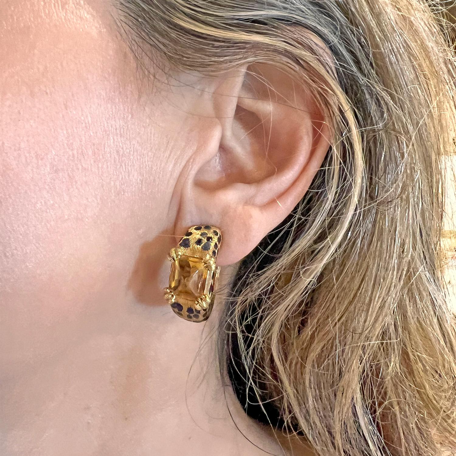 Hoop earrings, each showcasing a sugarloaf cabochon-cut citrine set with leopard paw motif prongs, in textured 18k yellow gold decorated with black enamel leopard spots.  Citrines each measuring approximately 9 x 7mm.  Signed 'Dior' '750' with