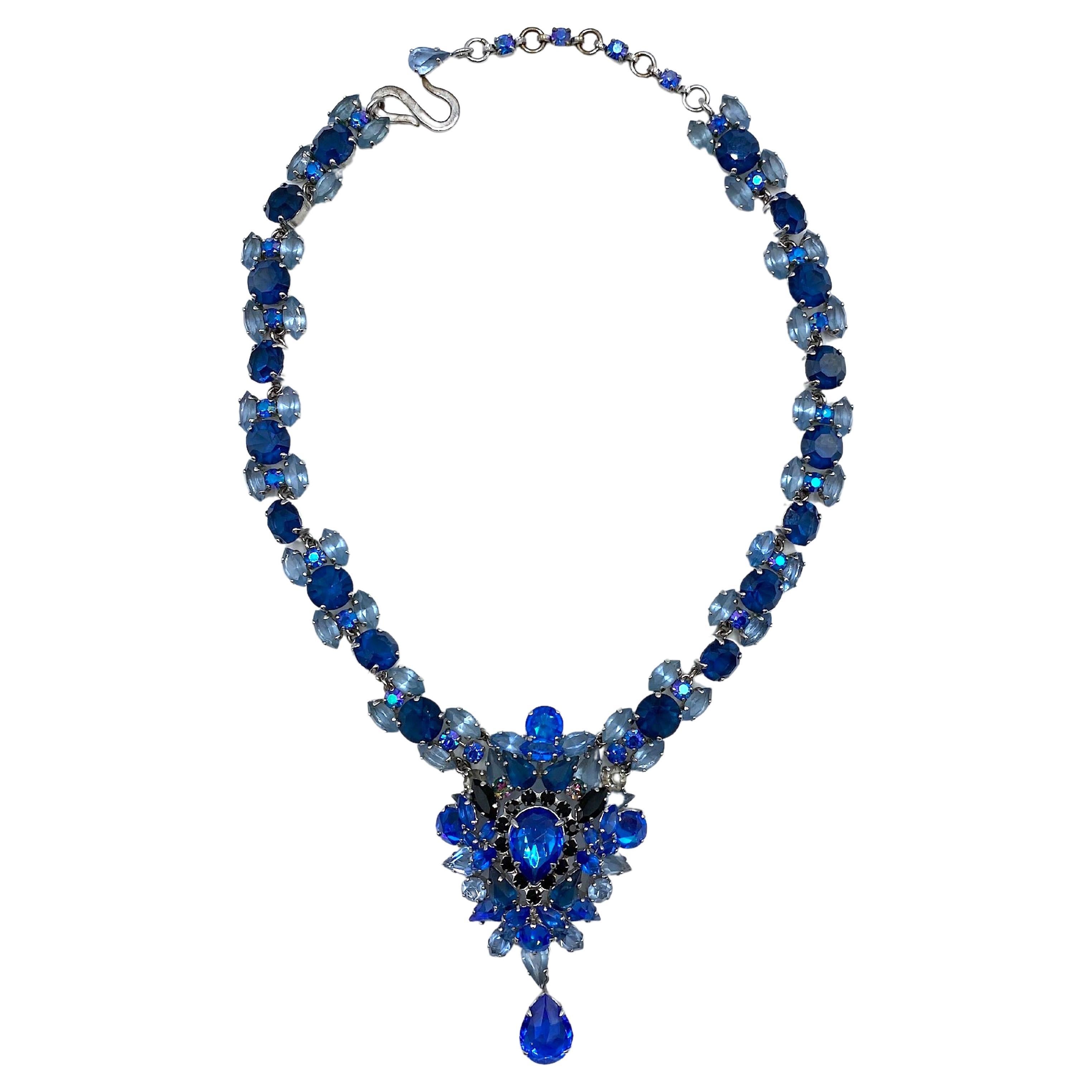 A stunning and rare Christian Dior necklace produced in 1959 by Henkel and Grosse' of Germany and attributed to designer Michaell Maer for Dior. He was noted for his use of many shades of blute stones in his Dior jewelry. The necklace is rhodium