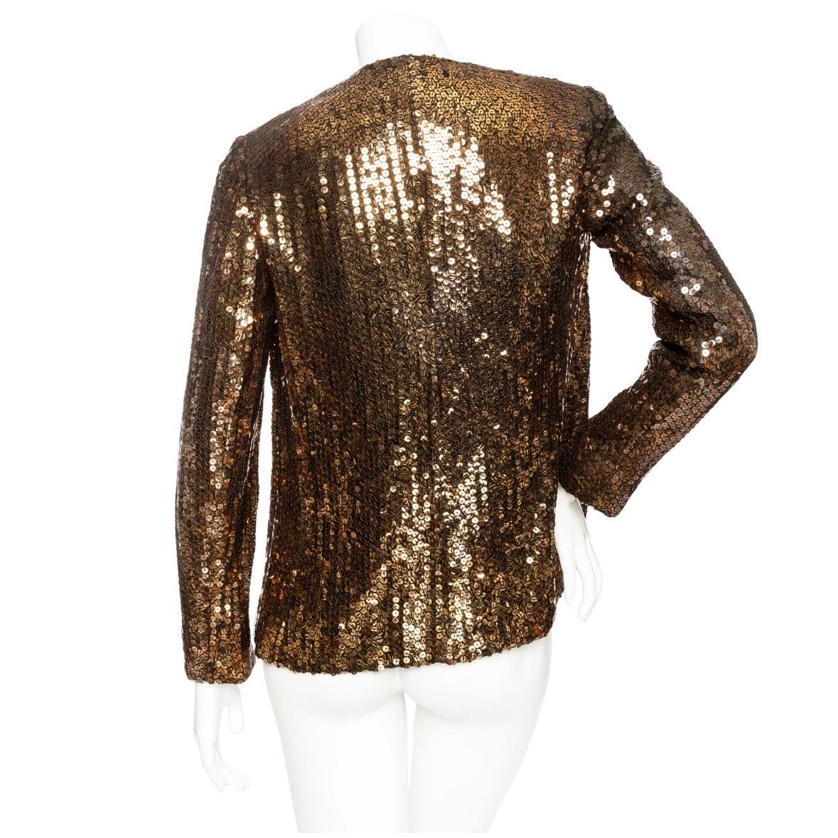 Christian Dior 1960s Copper and Black Tiger Print Sequin Jacket

Vintage; 1960s
Copper/Black
Tiger stripe print sequins
Collarless
Round neck
Open front
Made in France
Good pre-owned vintage condition; some loose threads and armhole needs repair