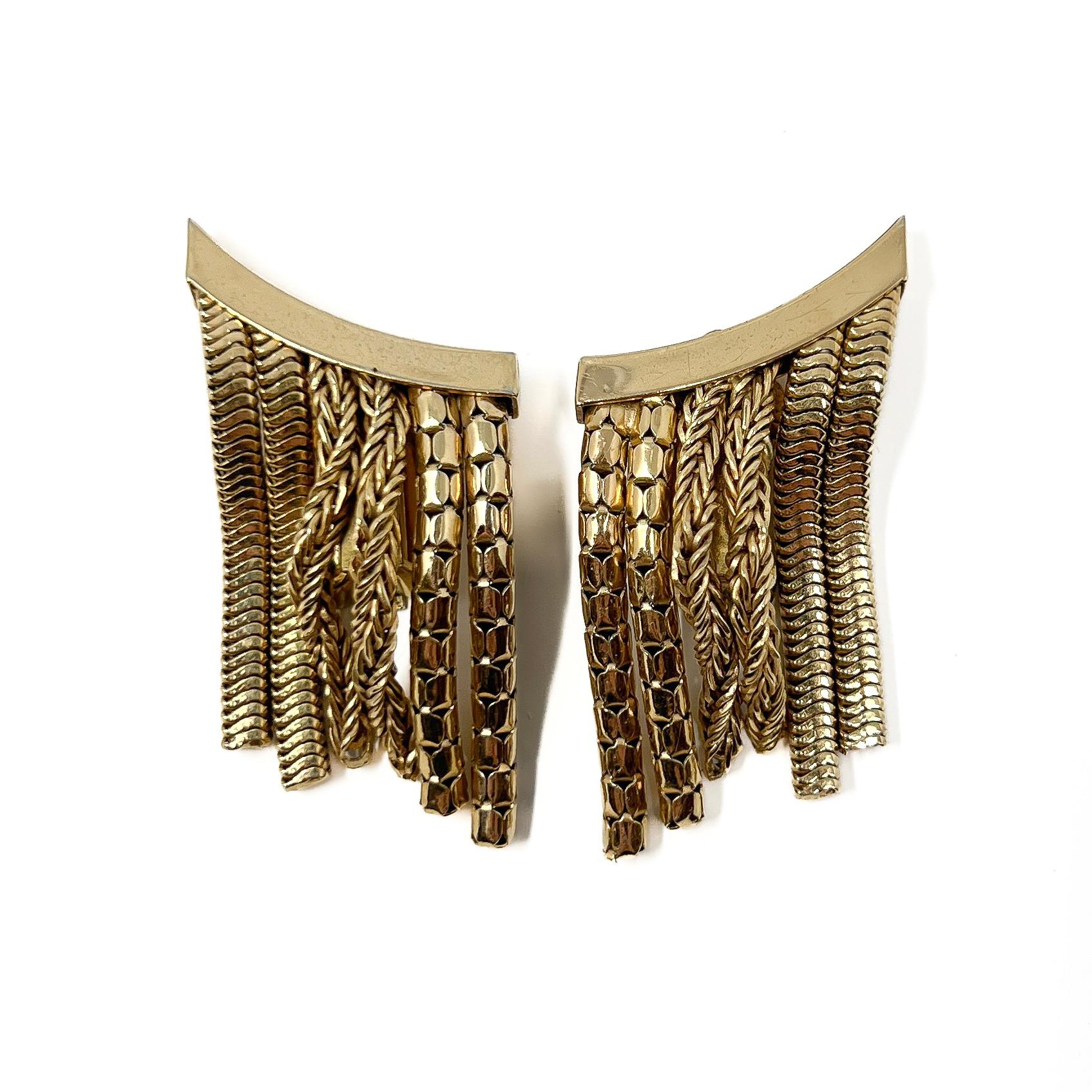 These stylish earrings were designed and made in Germany in the 1960s by Henkel and Grossé for Christian Dior. 

Condition Report:
Excellent

The Details...
These gold plated earrings are shaped to match the curve of the ear and climb up it. They
