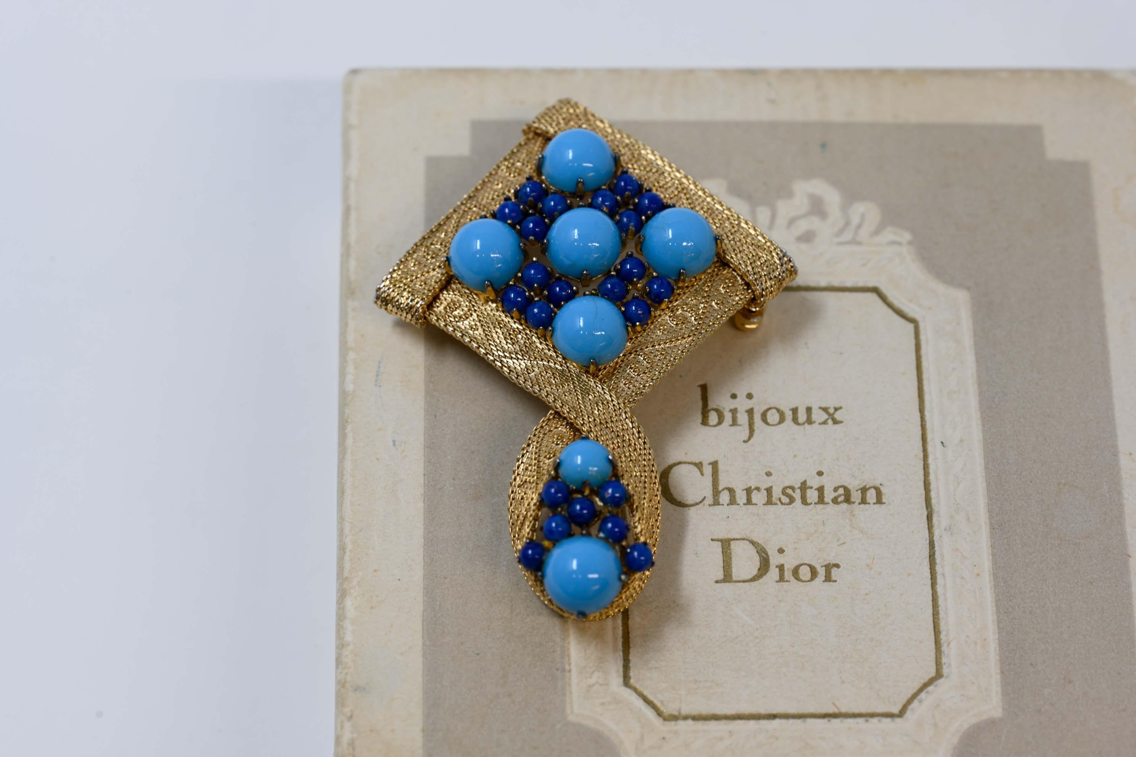 Christian Dior 1962 blue turquoise cabochon gold tone brooch and lapis lazuli cabochon stone. Marked on the back and dated. Made in Germany, measures 2 1/2 inches x 1 3/4 inches in excellent condition.