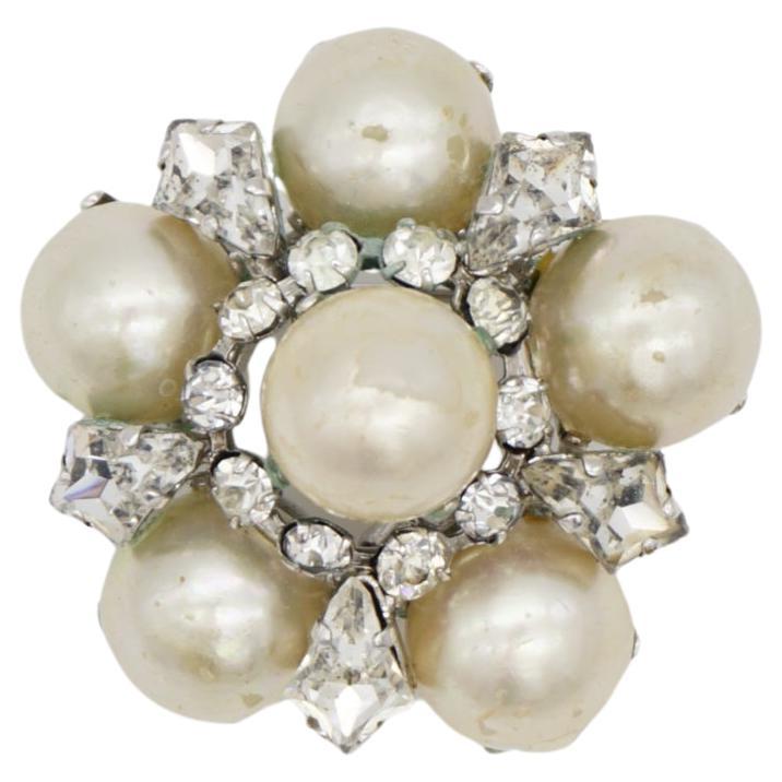 Christian Dior 1962 Vintage White Round Pearls Shining Crystals Openwork Floral Dome Brooch, Silver Tone

Good condition. Some peel off at faux pearls, light scratches or colour loss. 100% Genuine.

A unique piece. This is silver plated stylised